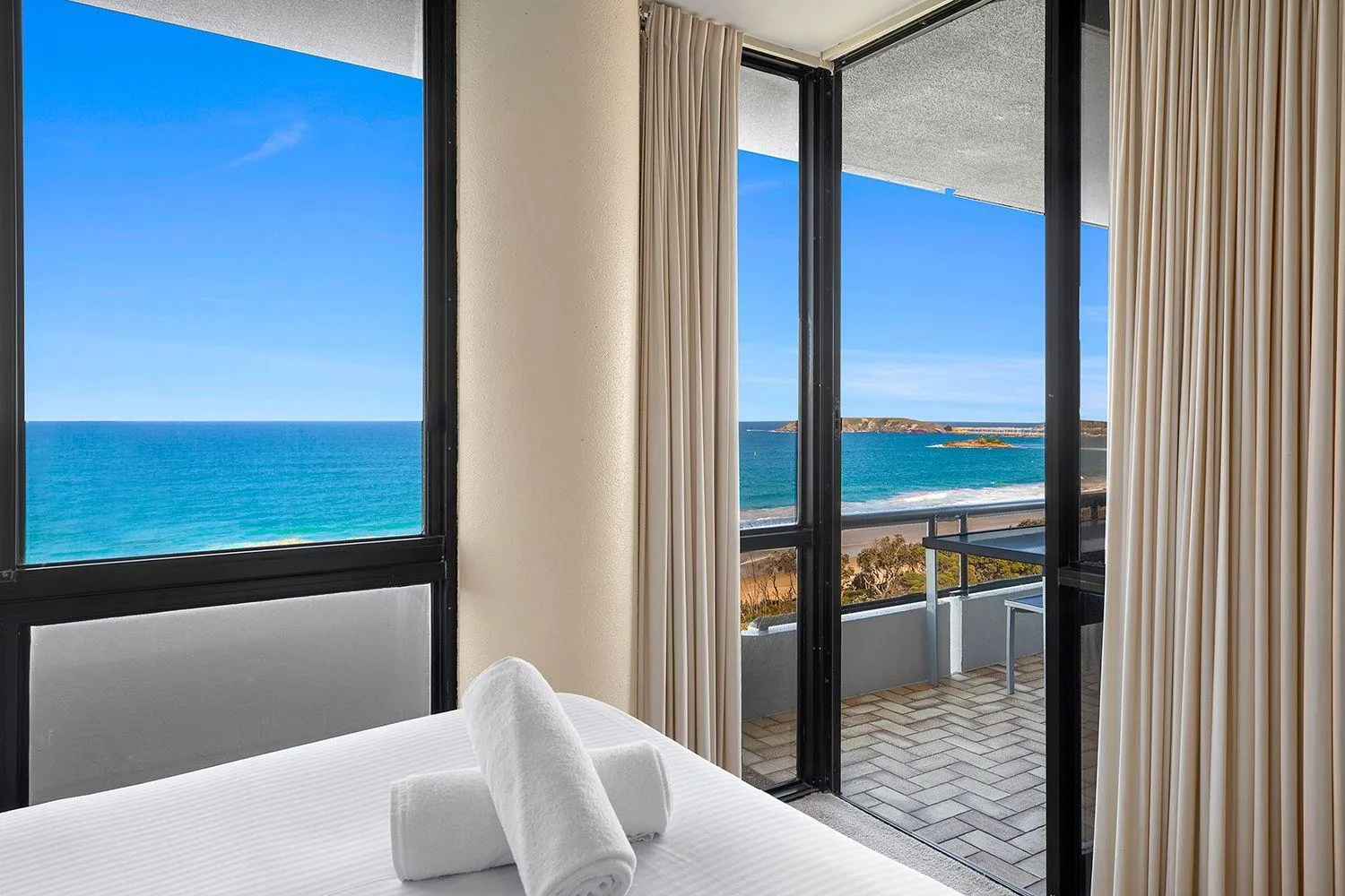 Bed in Pacific Towers Beach Resort