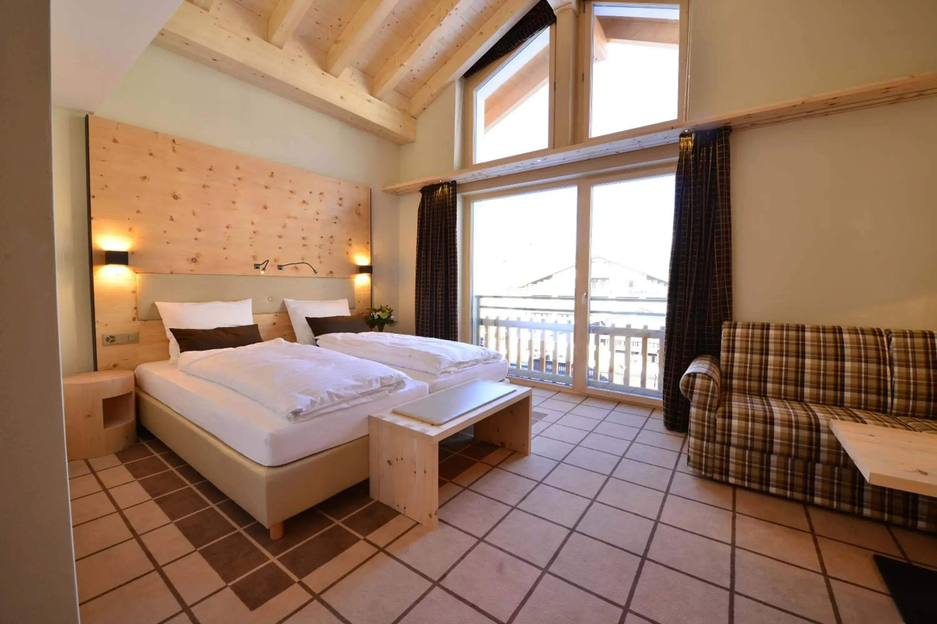 Bed in Alpenhotel Fleurs de Zermatt Bed in Alpenhotel Fleurs de Zermatt