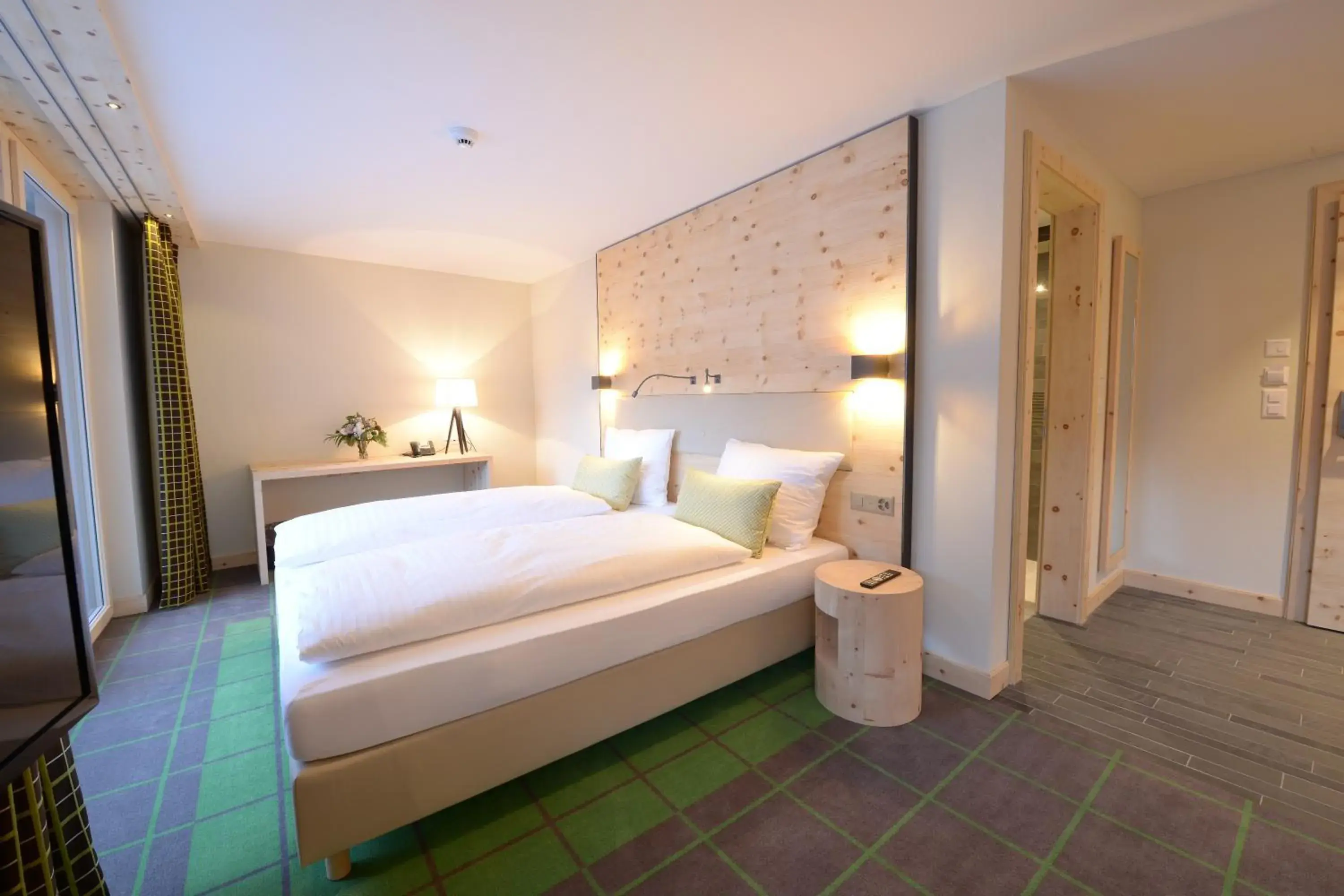 Bed in Alpenhotel Fleurs de Zermatt Bed in Alpenhotel Fleurs de Zermatt