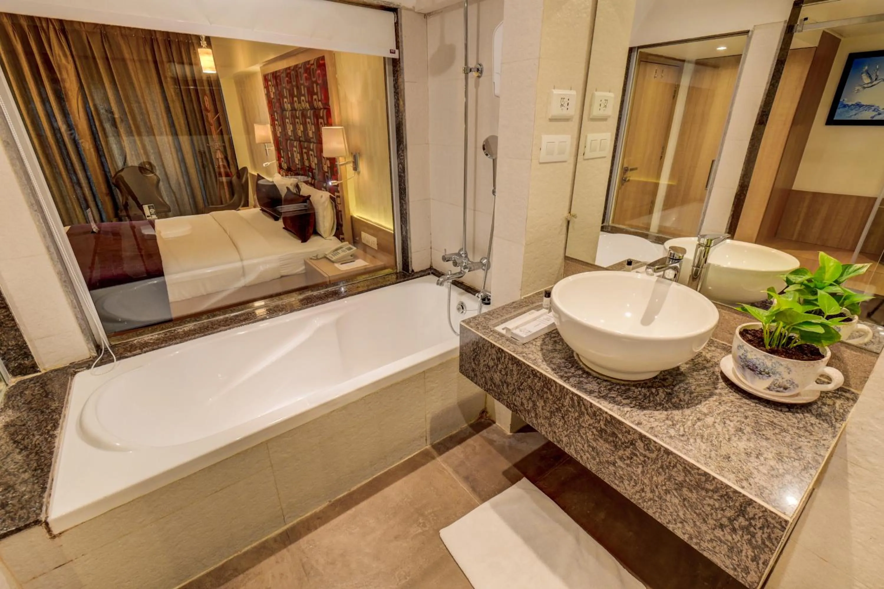 Bath, Bed in The SSK Solitaire Hotel & Banquets