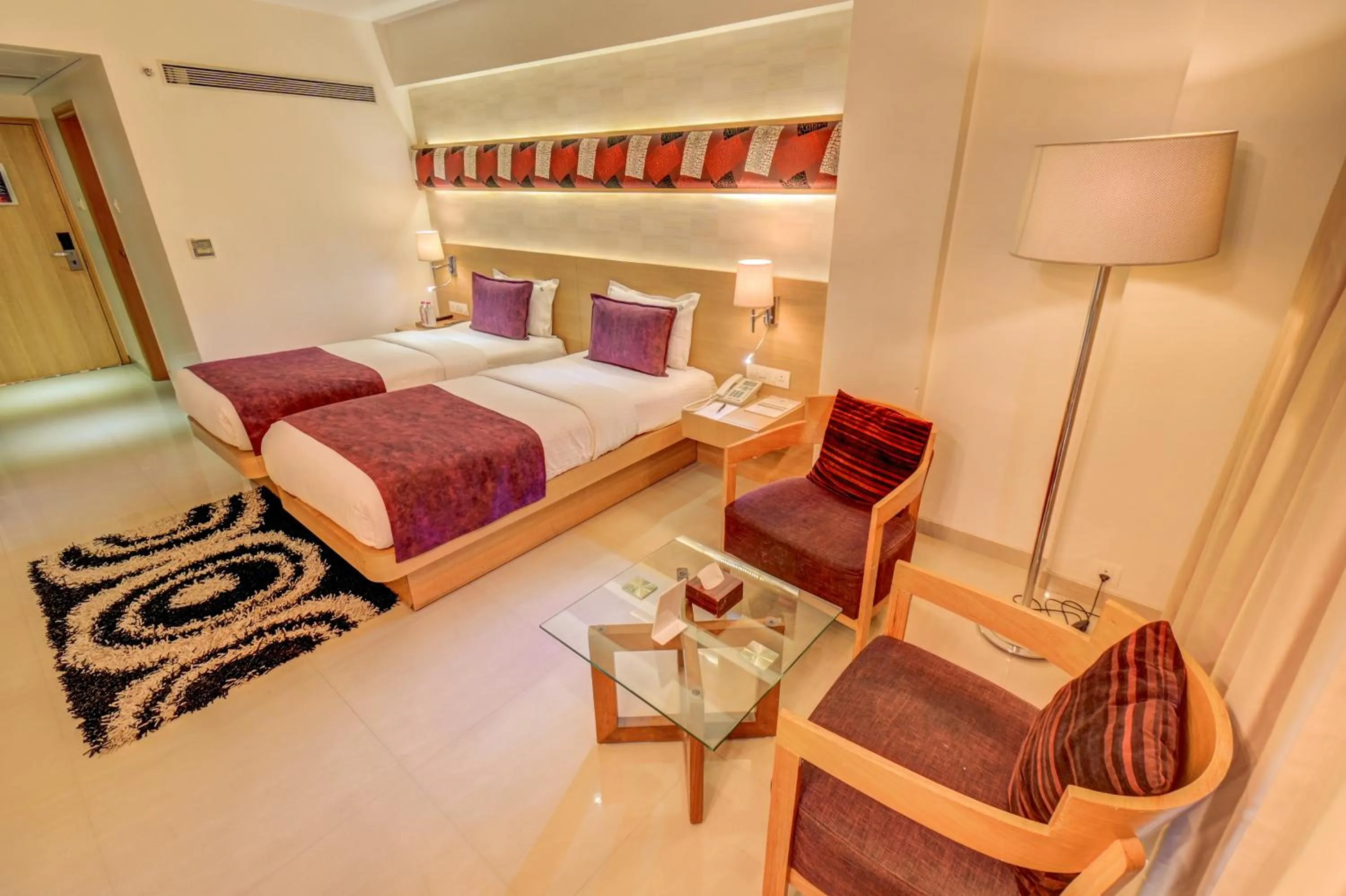 Bed in The SSK Solitaire Hotel & Banquets