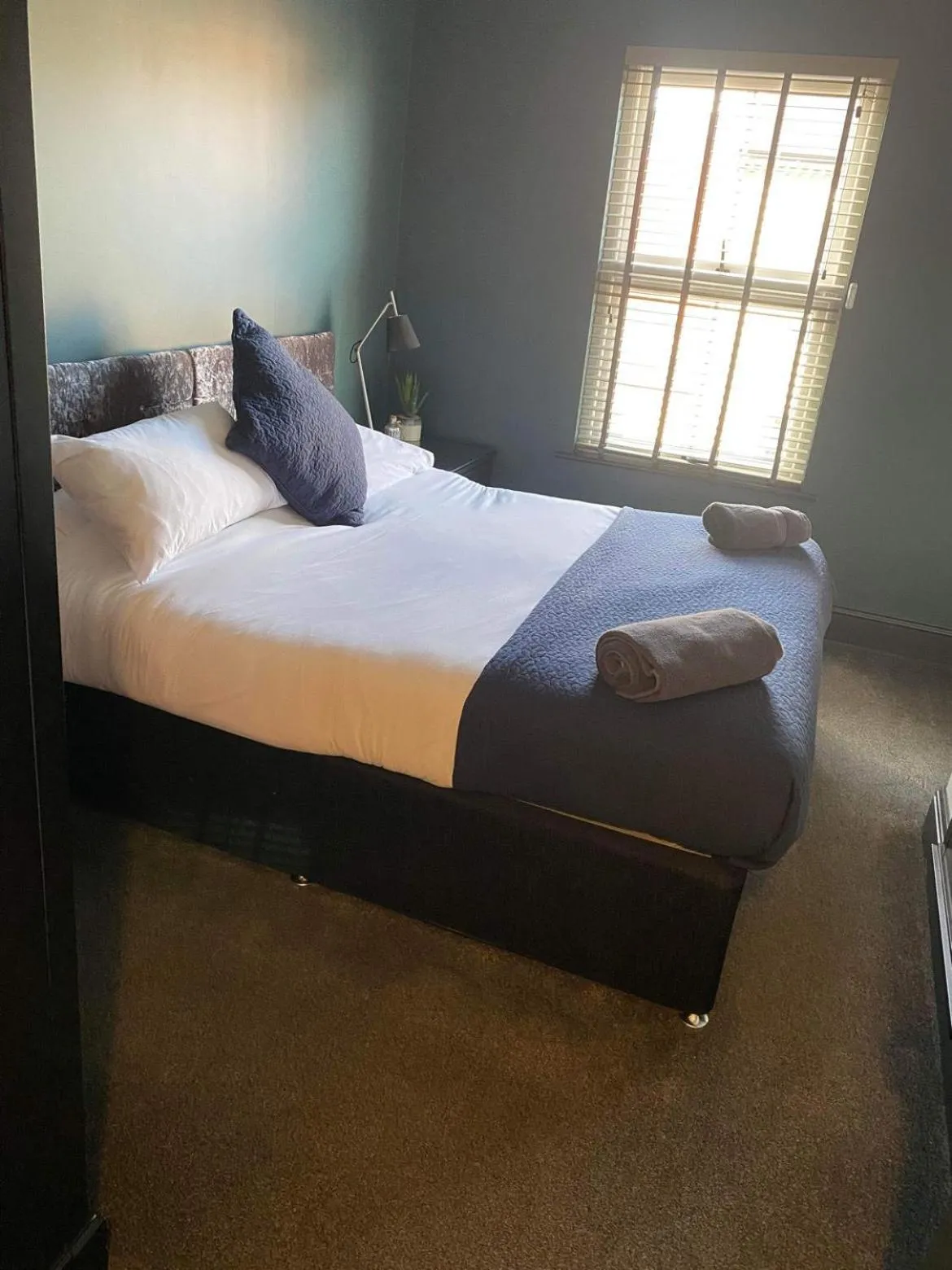 Bed in Raby Apartment