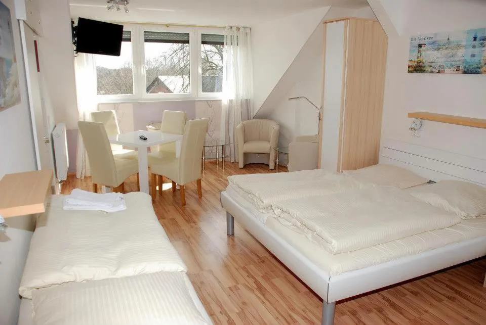 Photo of the whole room, Bed in Landgasthof Tarp