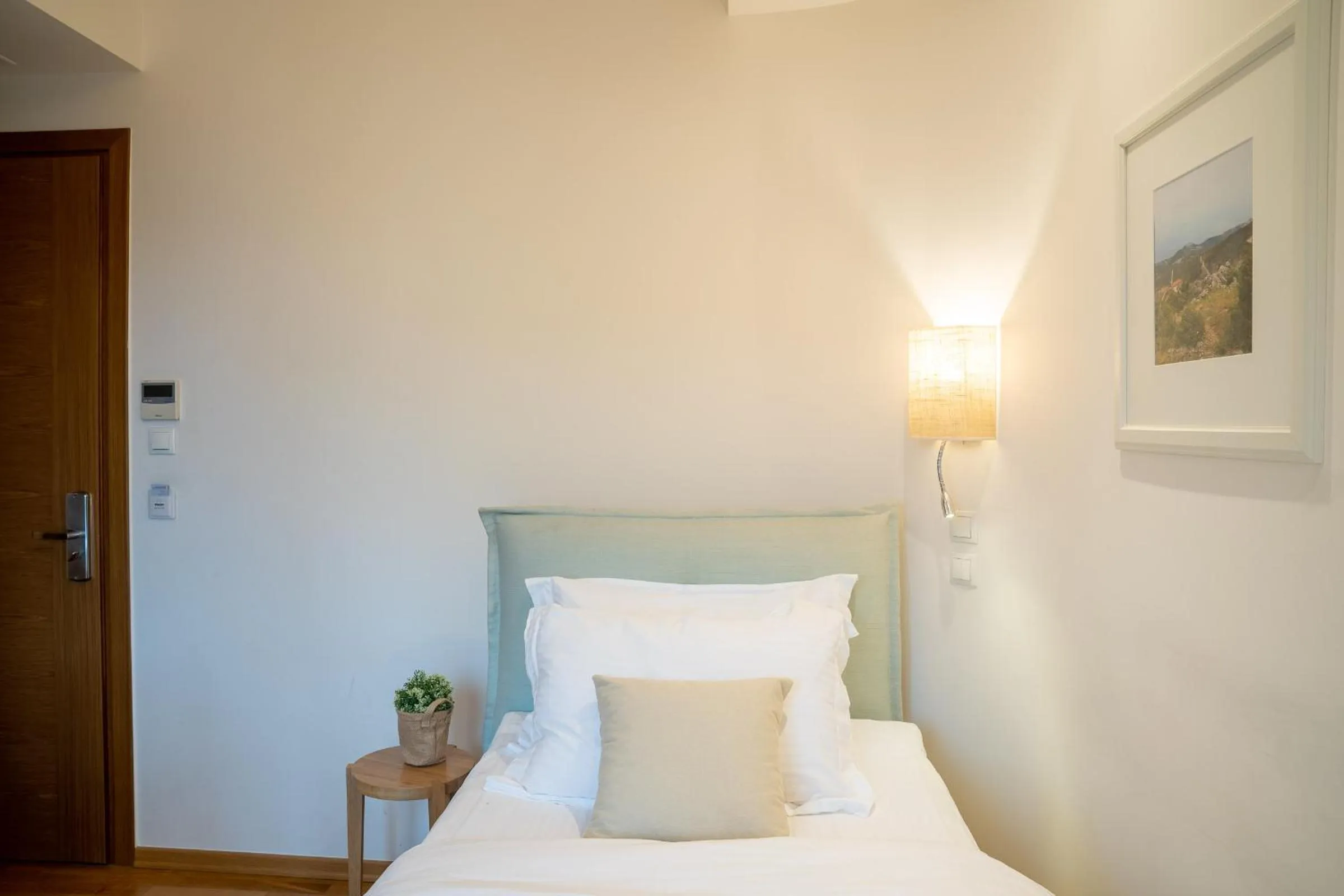 Bed in Olympus Terra Boutique Hotel