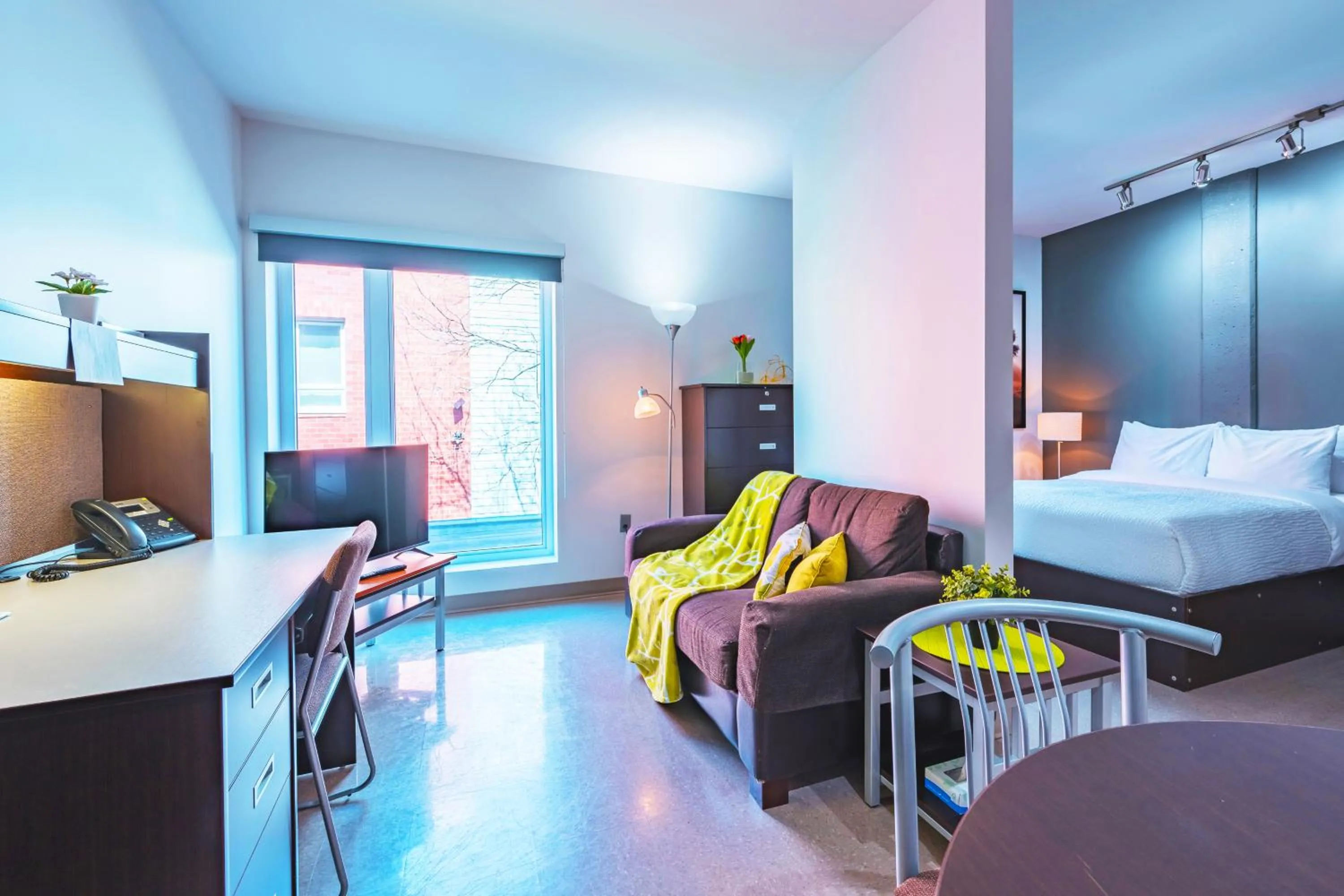 Living room, Bed in Résidences Université du Québec