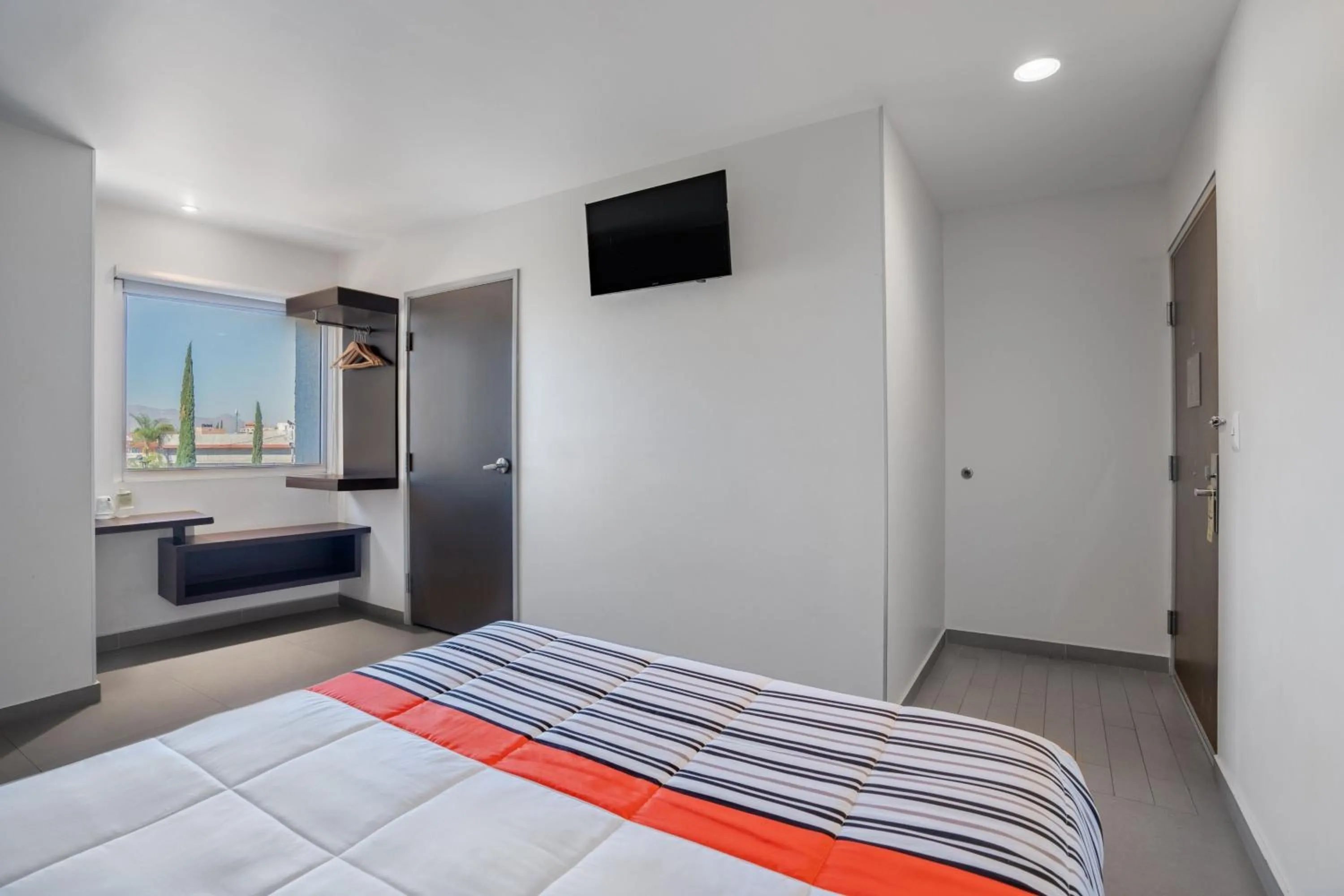 Photo of the whole room, Bed in City Express Junior by Marriott Aguascalientes Centro