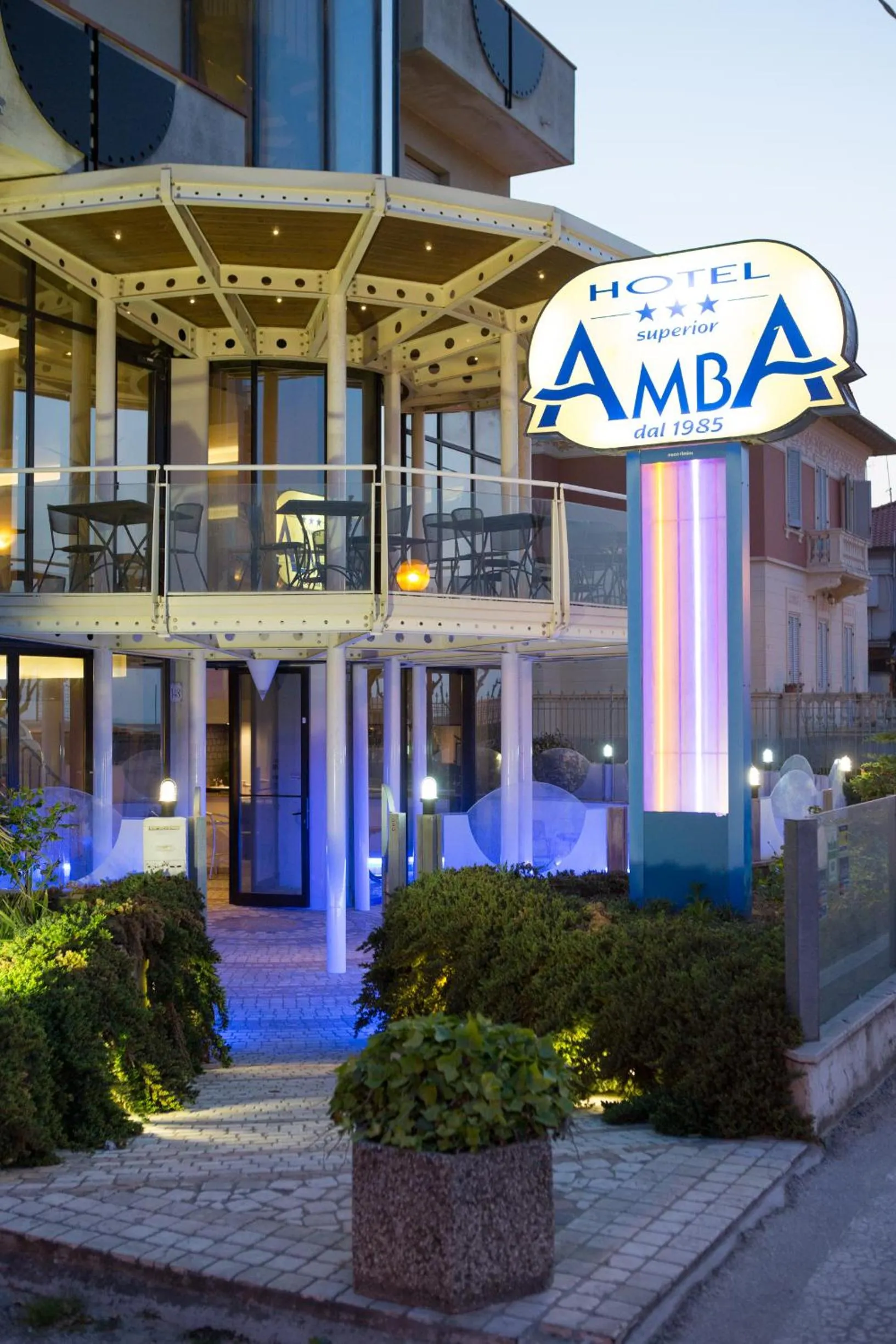 Property logo or sign in Amba Hotel