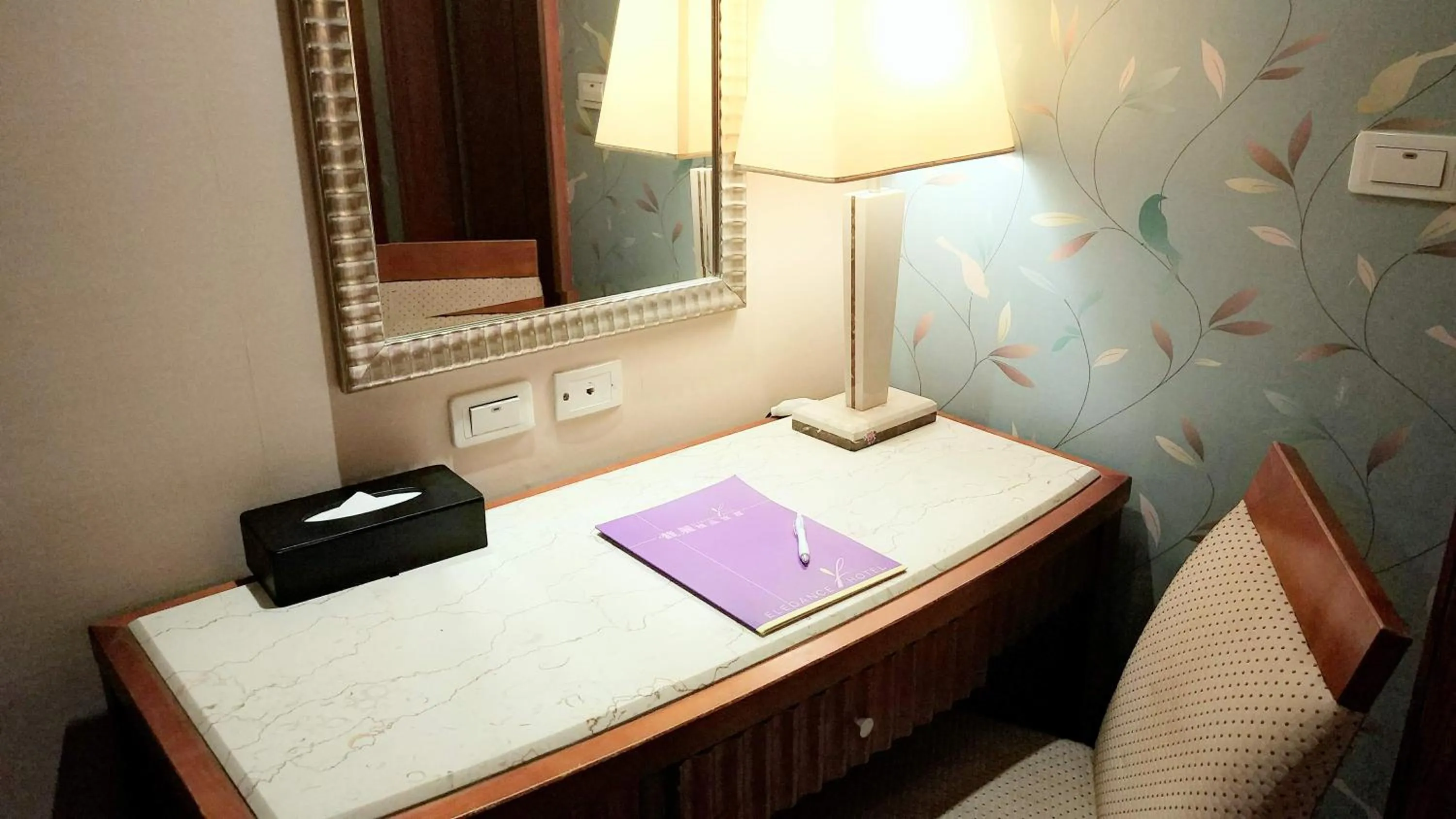 Seating area, Bed in Elegance Hotel