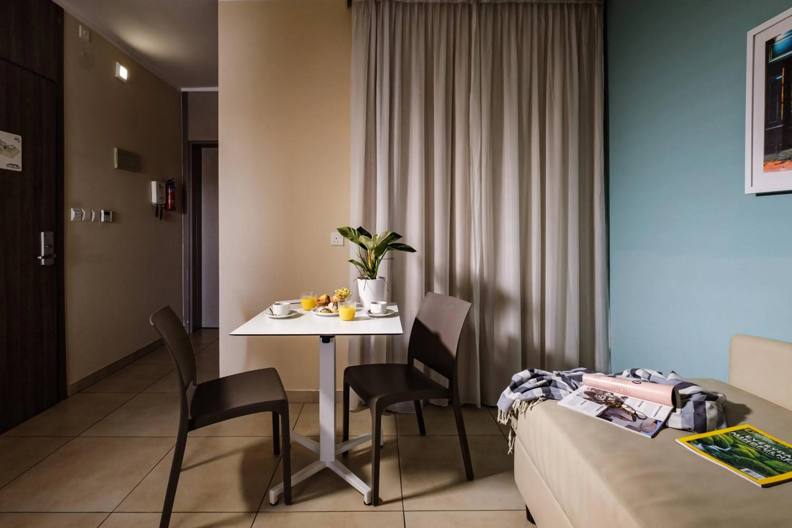 Bedroom in 115 The Strand Hotel by NEU Collective