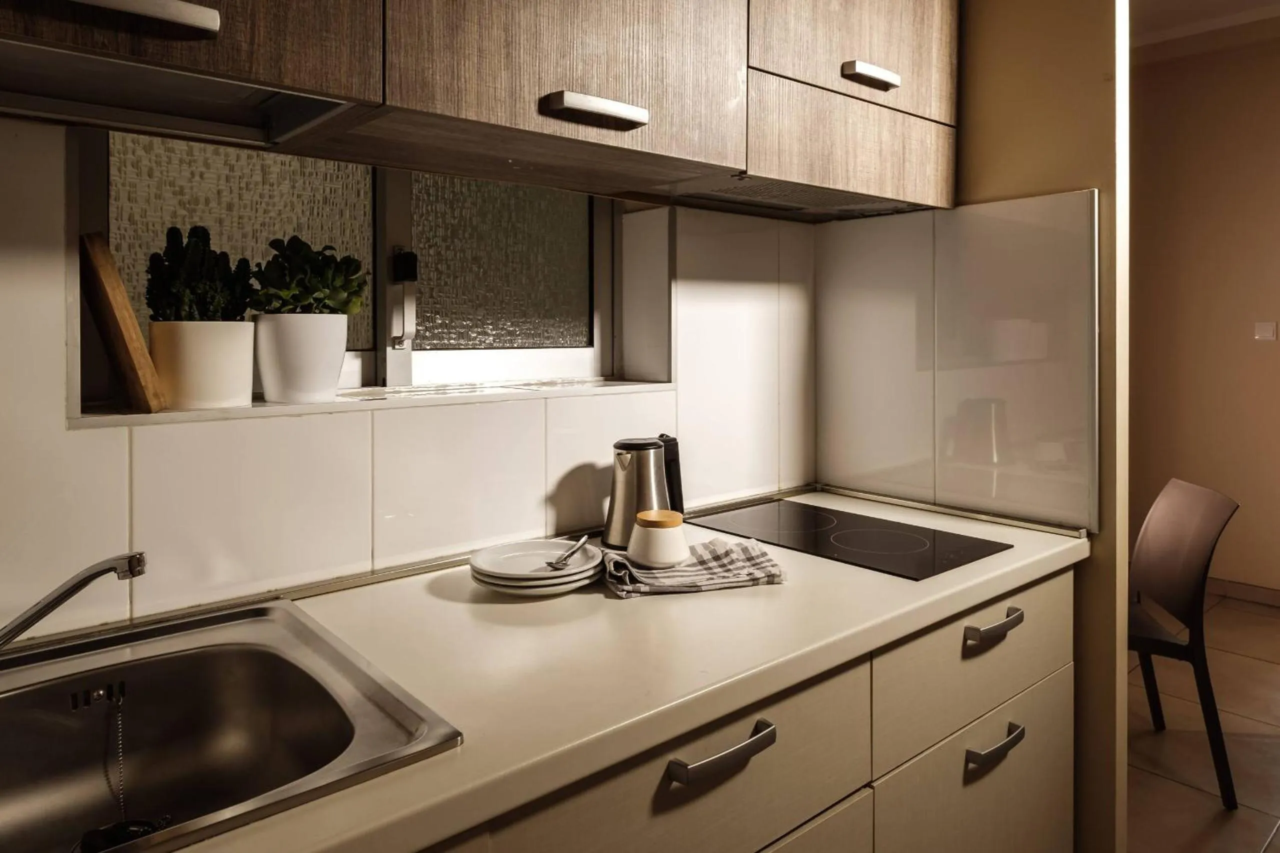 Kitchen or kitchenette in 115 The Strand Hotel by NEU Collective