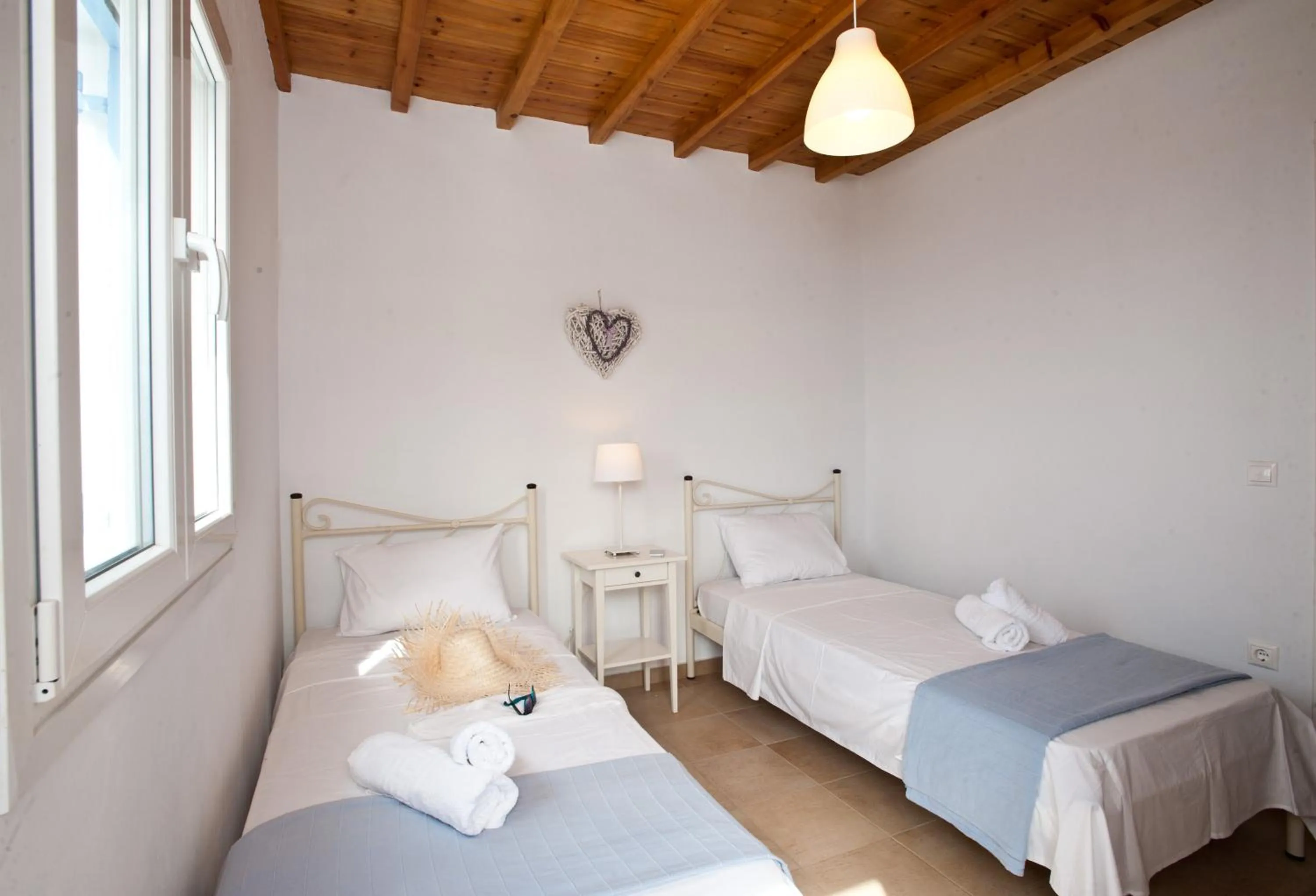 Bed in Sea Wind Villas and Suites