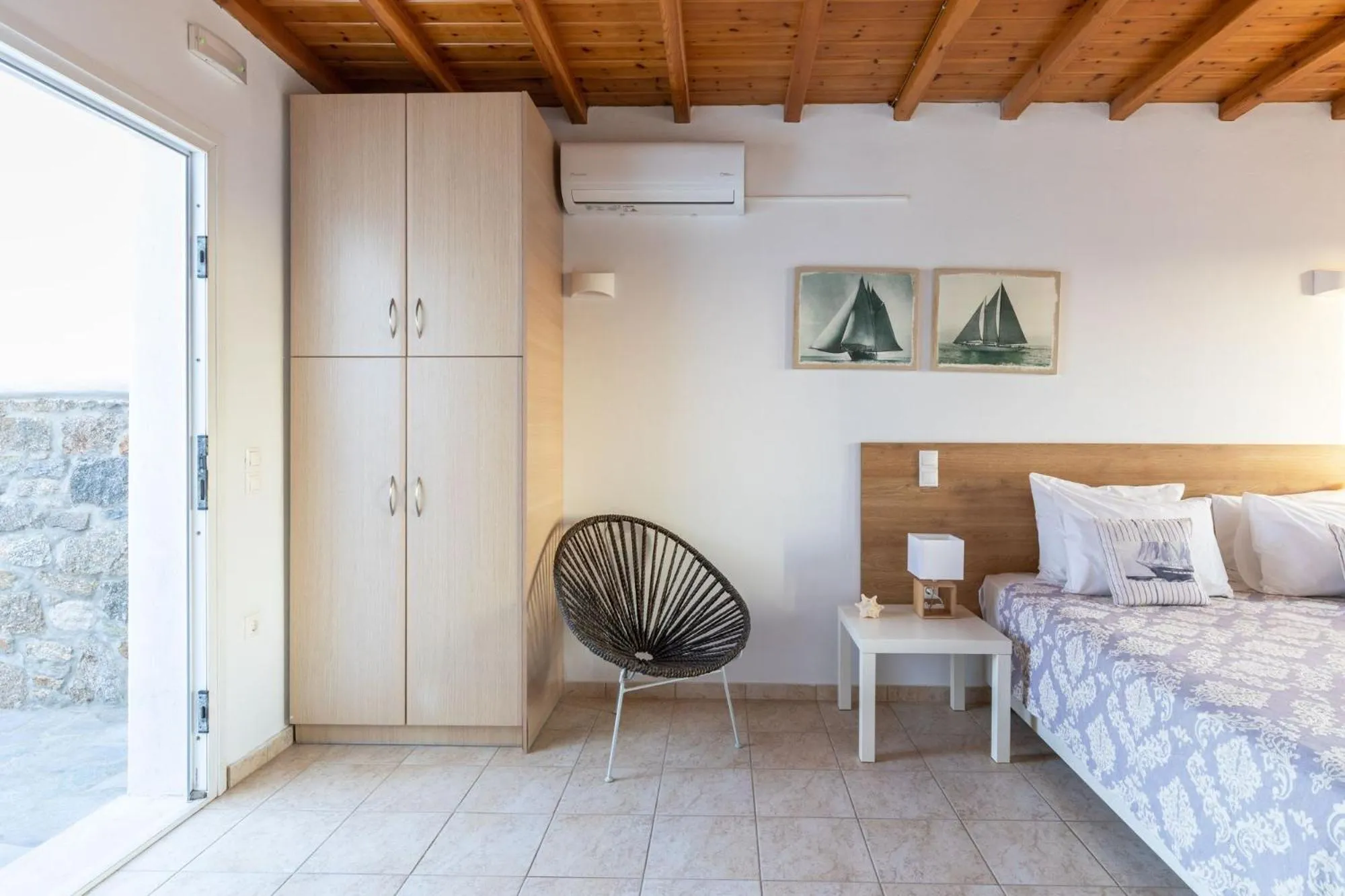 Facade/entrance, Bed in Sea Wind Villas and Suites