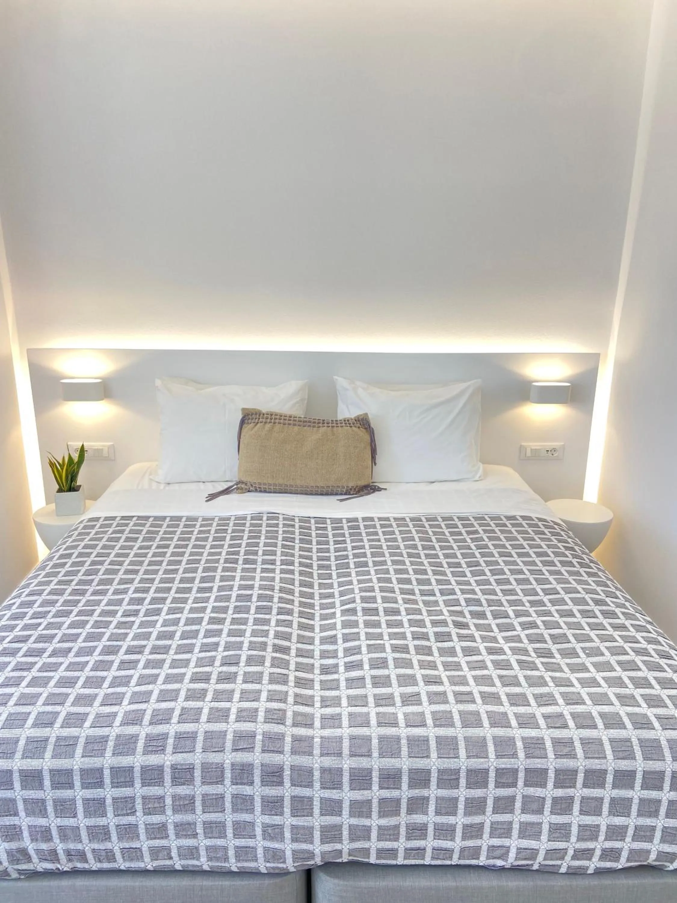 Bed in Sea Wind Villas and Suites