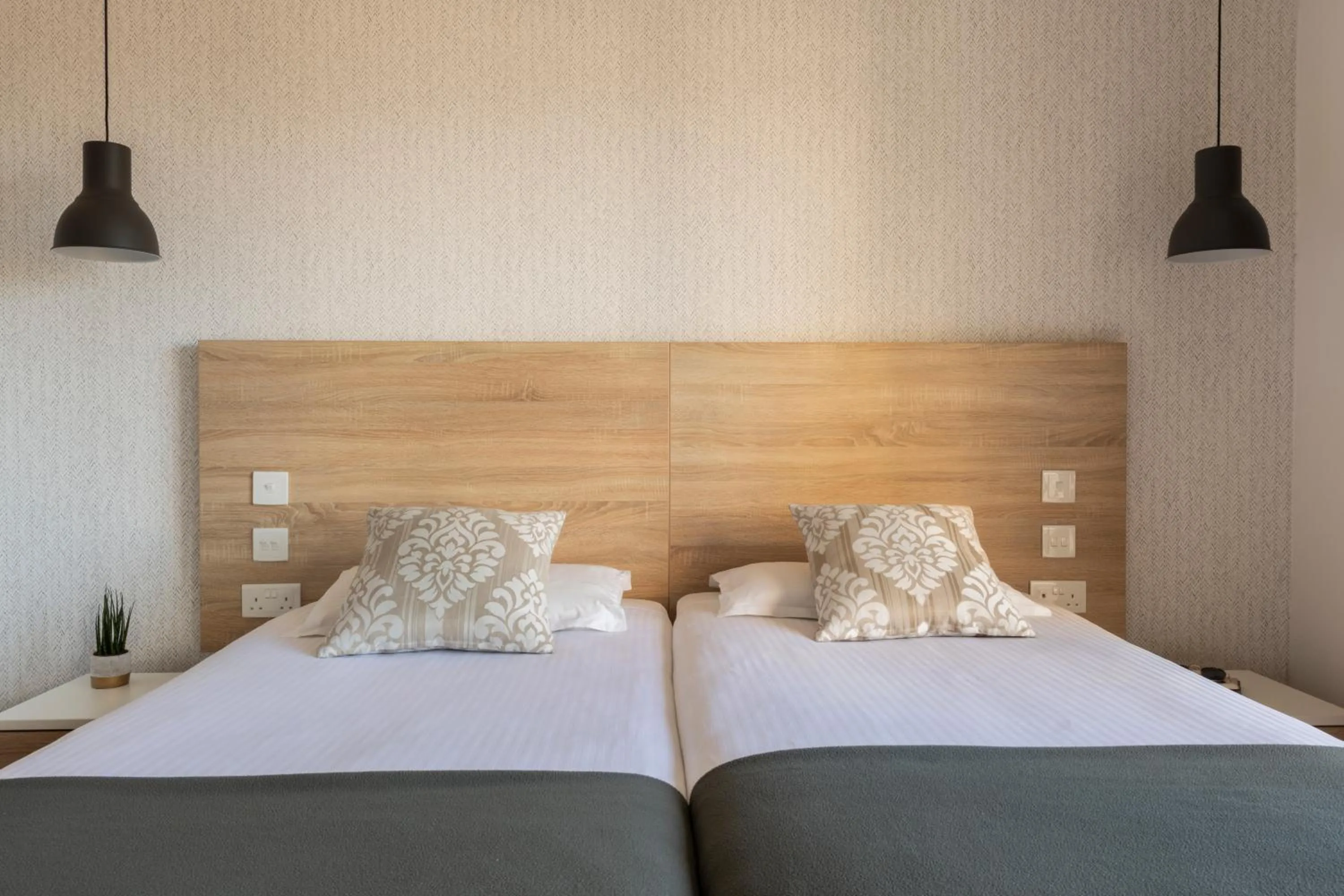 Bed in Plaza Regency Hotels