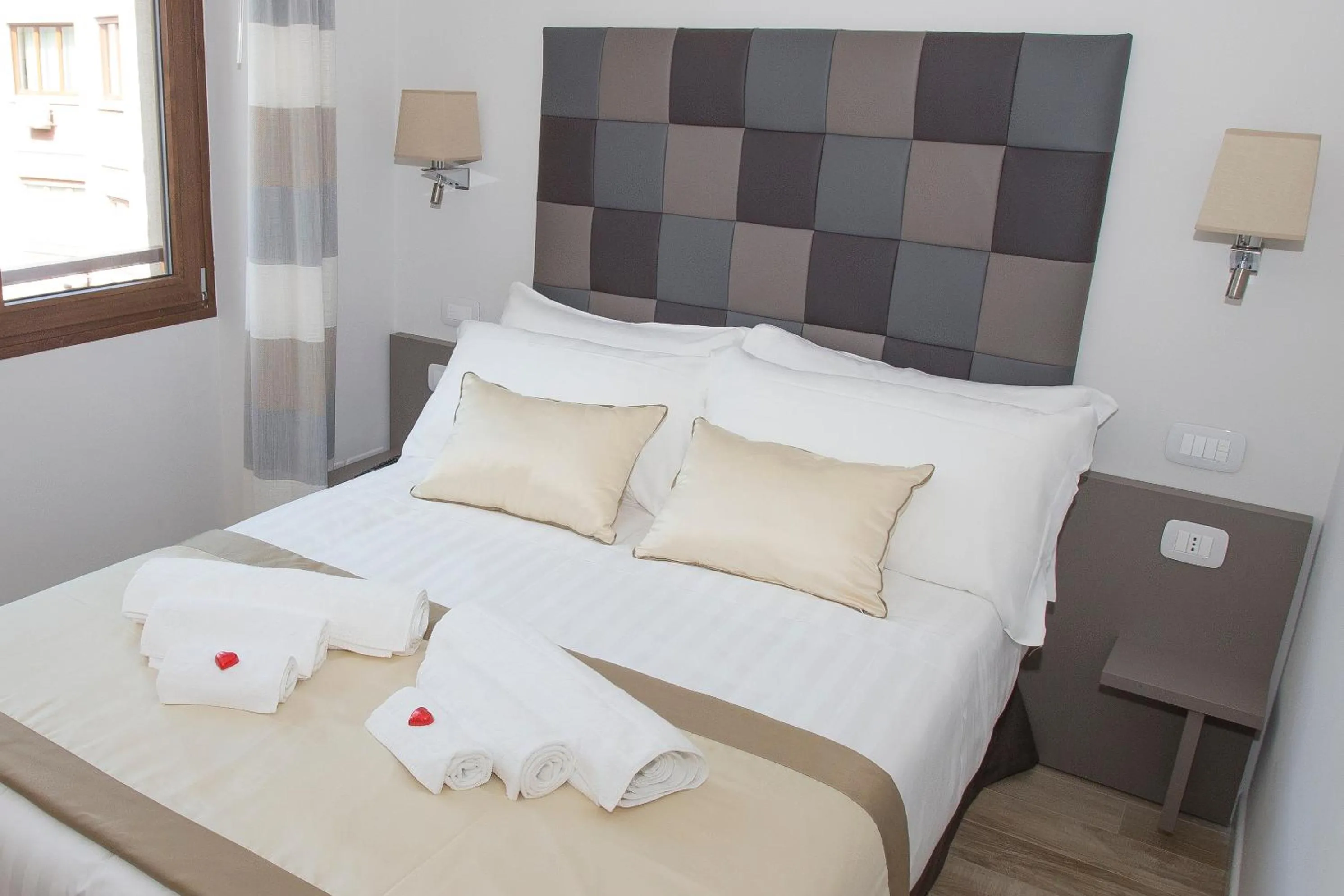 Bed in Leonardo Da Vinci Guest House