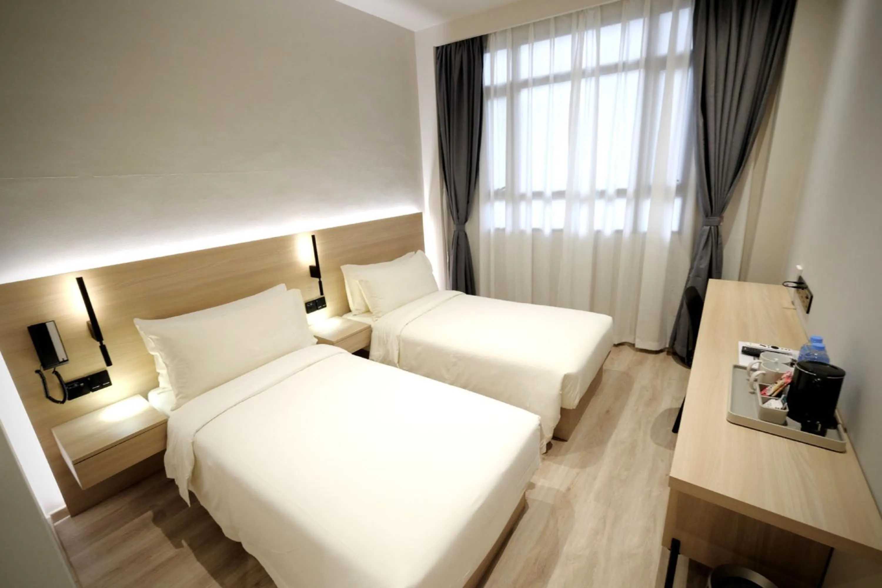 Bed in Rest Bugis Hotel