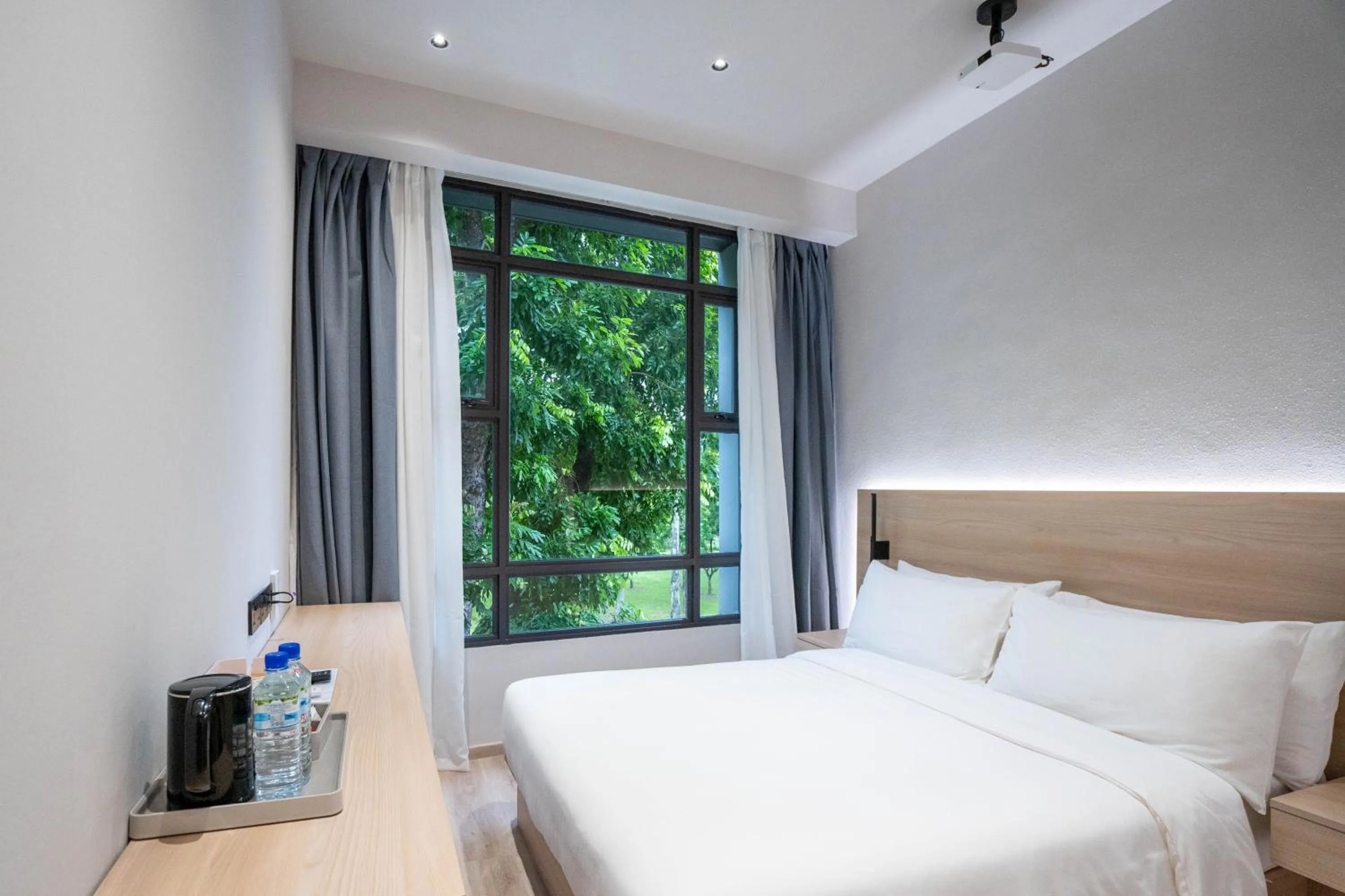 Bed in Rest Bugis Hotel