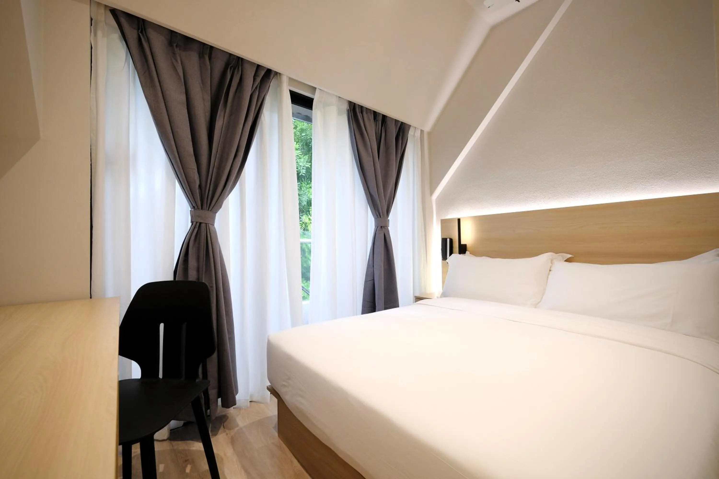 Bed in Rest Bugis Hotel