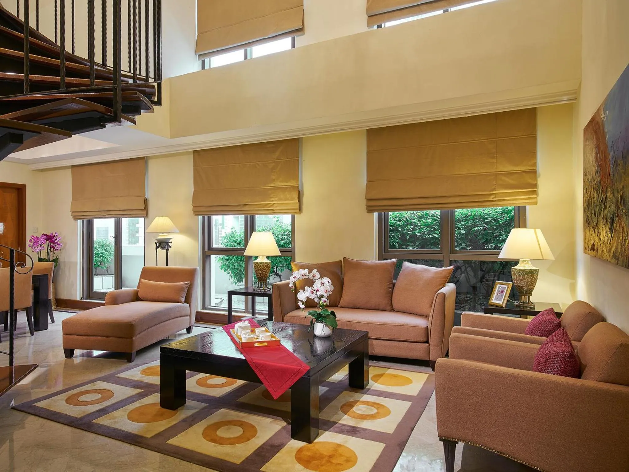 Communal lounge/ TV room in Orchard Parksuites by Far East Hospitality