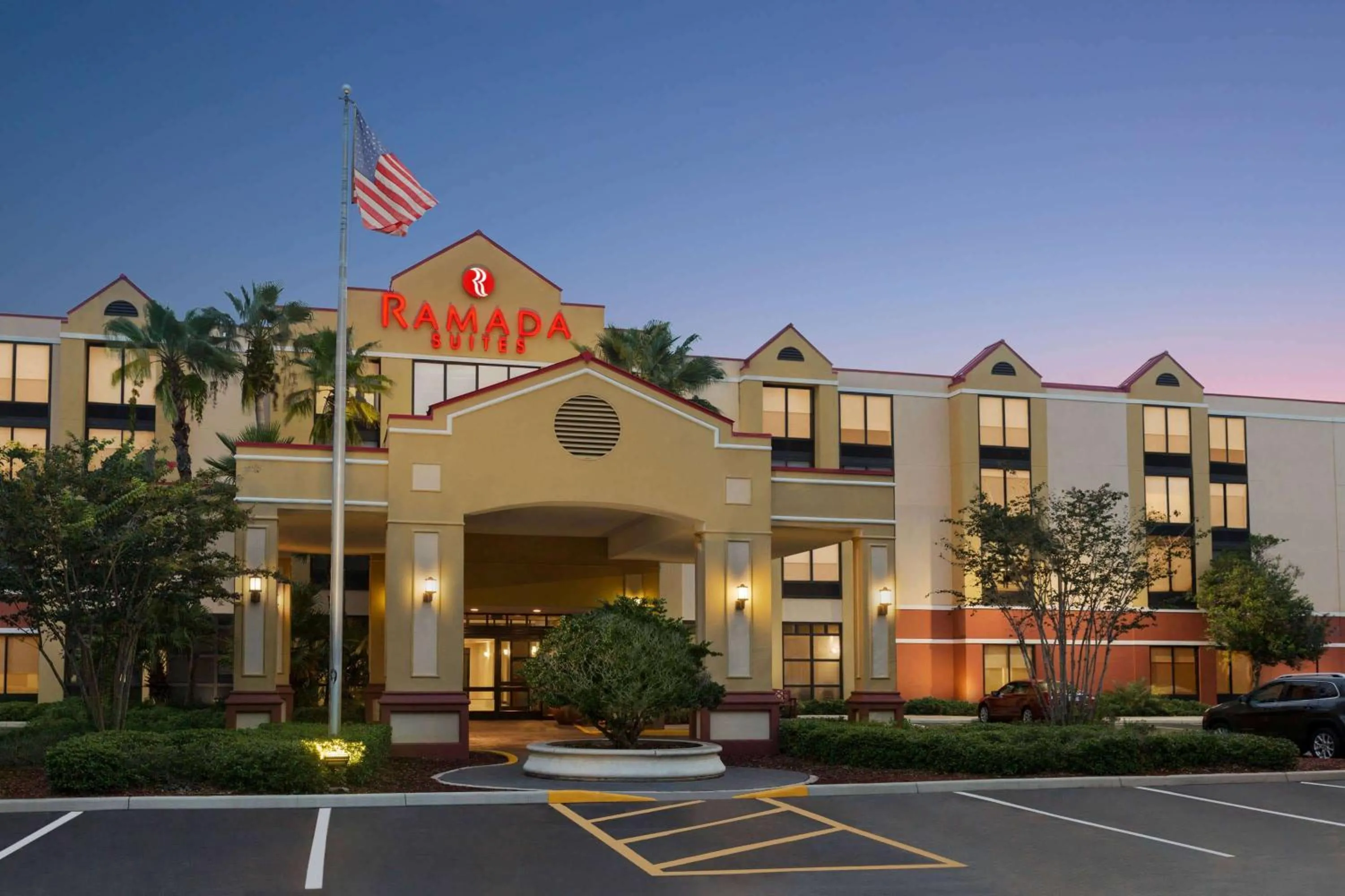 Property building in Ramada by Wyndham Suites Orlando Airport- Free Airport Shuttle