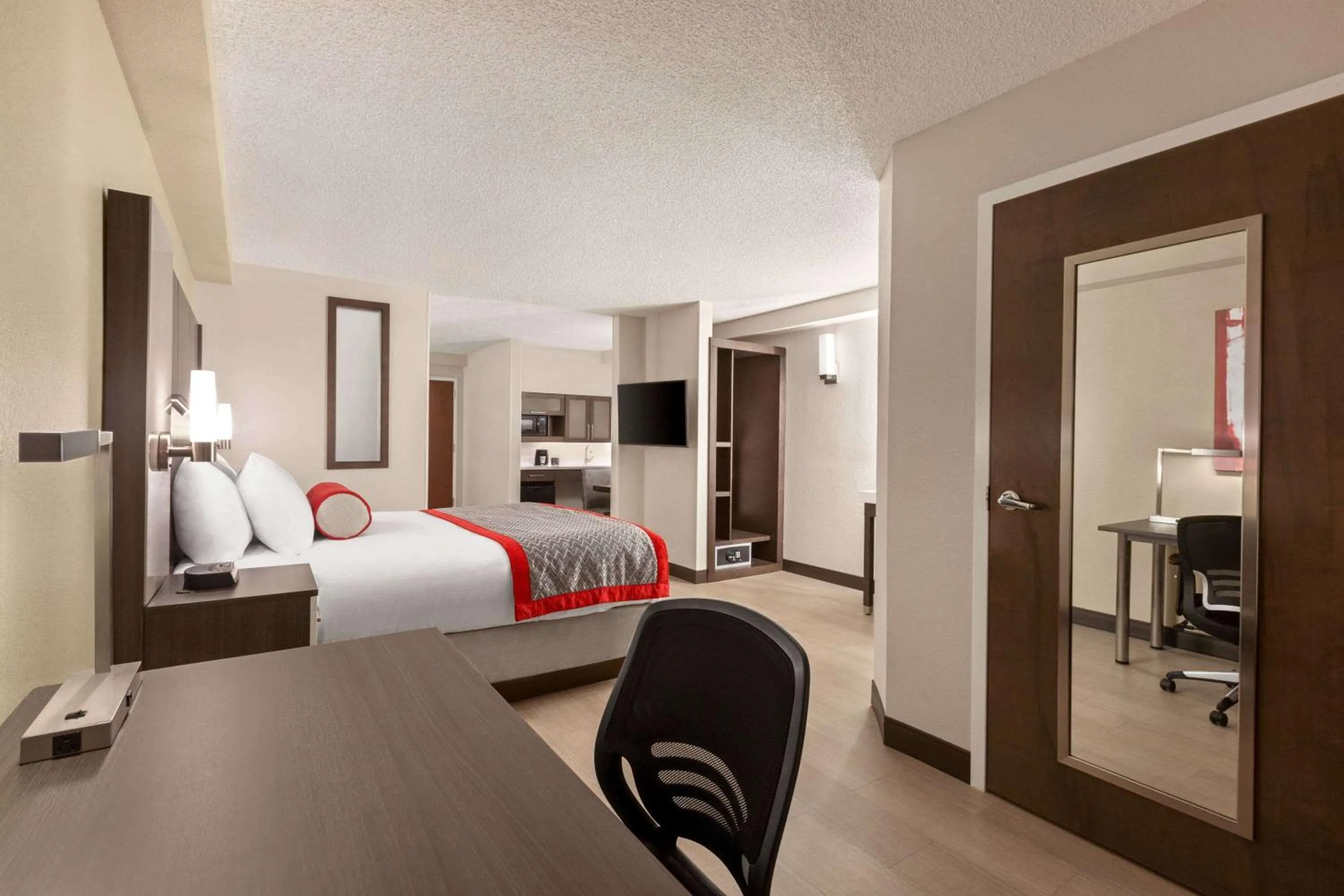 Photo of the whole room, Bed in Ramada by Wyndham Suites Orlando Airport- Free Airport Shuttle