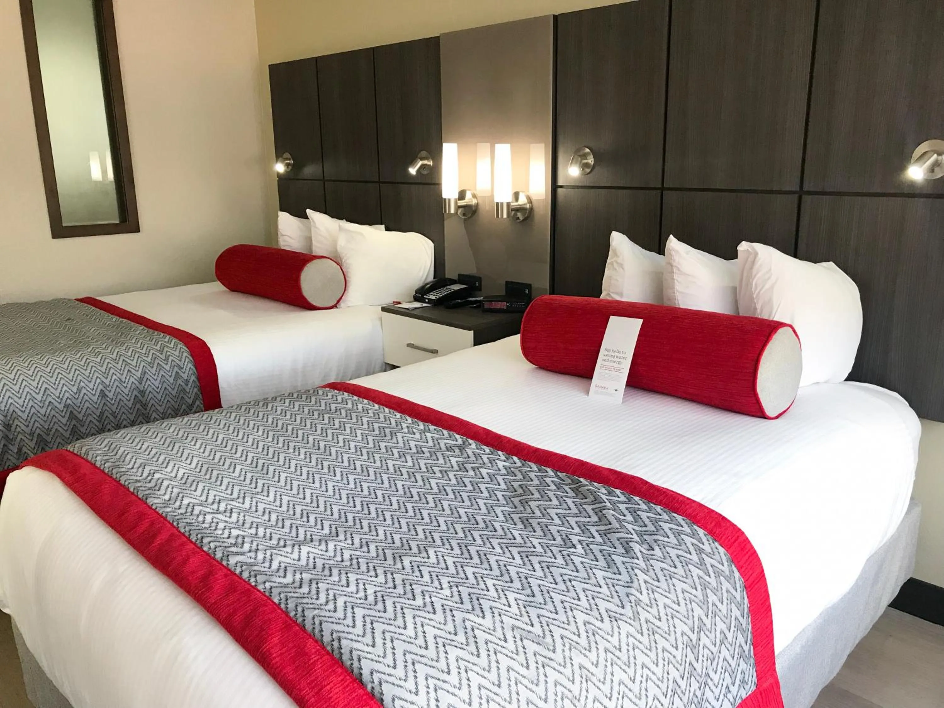 Bedroom, Bed in Ramada by Wyndham Suites Orlando Airport- Free Airport Shuttle