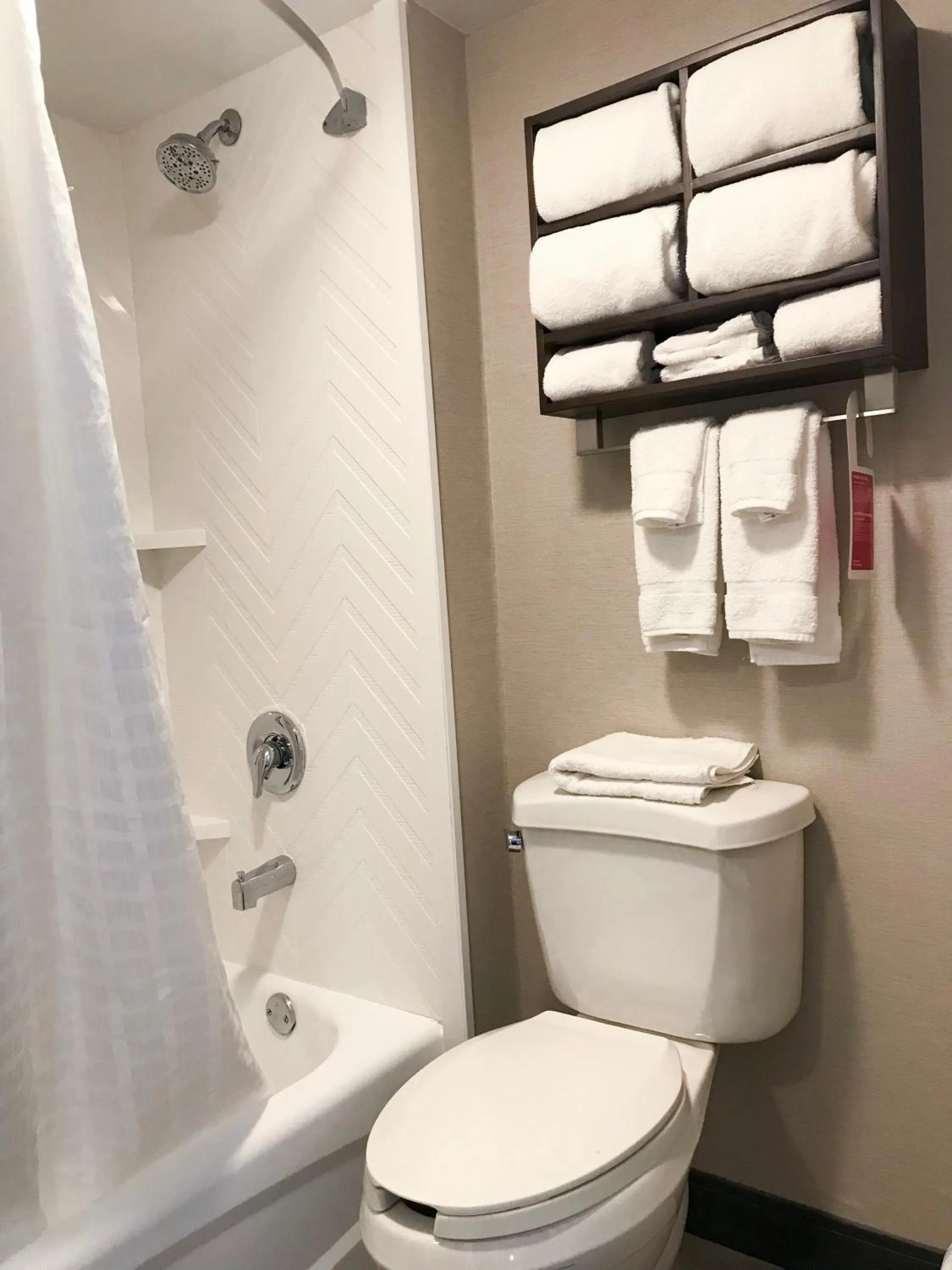 Bathroom in Ramada by Wyndham Suites Orlando Airport- Free Airport Shuttle