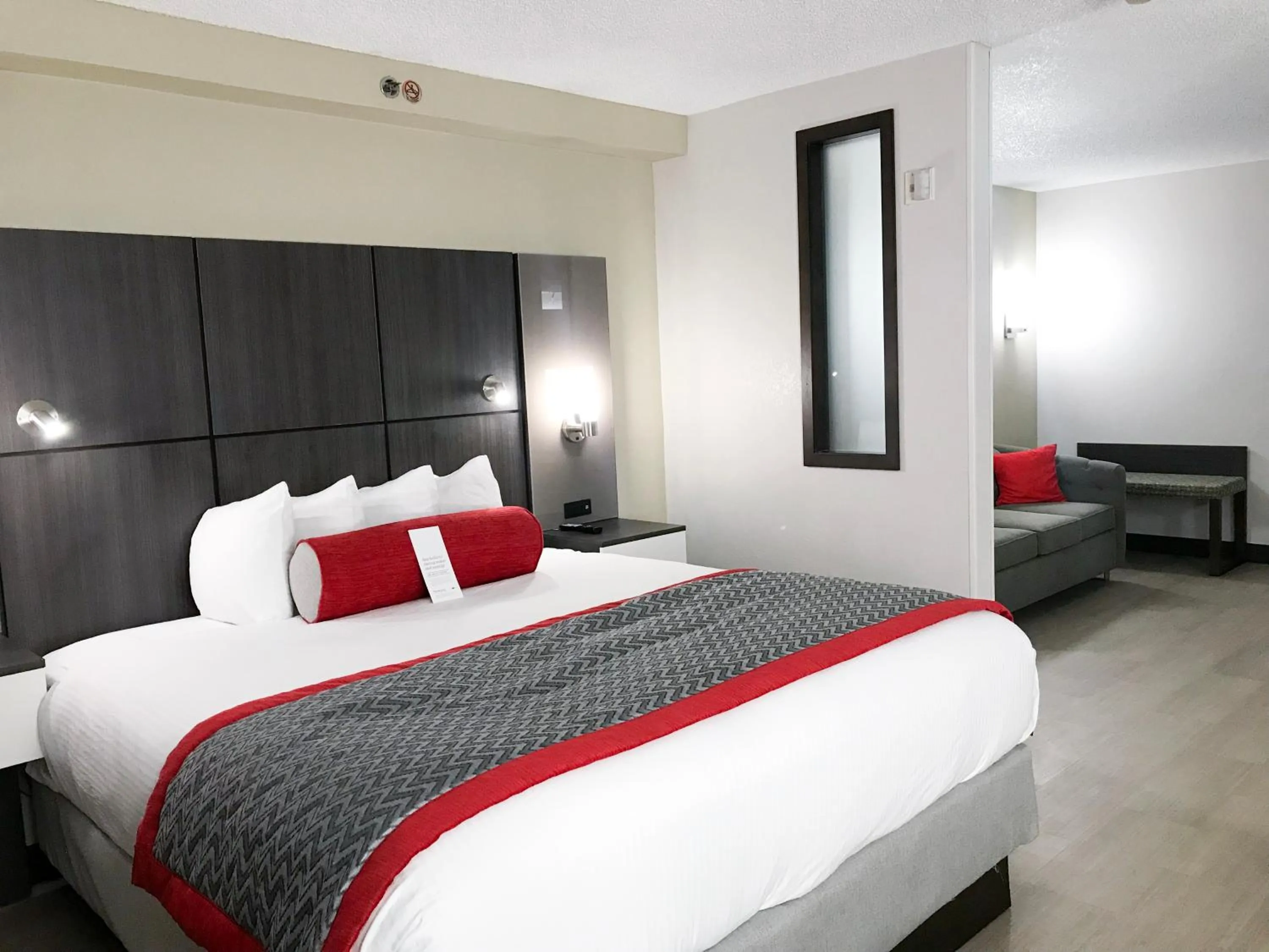 Photo of the whole room, Bed in Ramada by Wyndham Suites Orlando Airport- Free Airport Shuttle