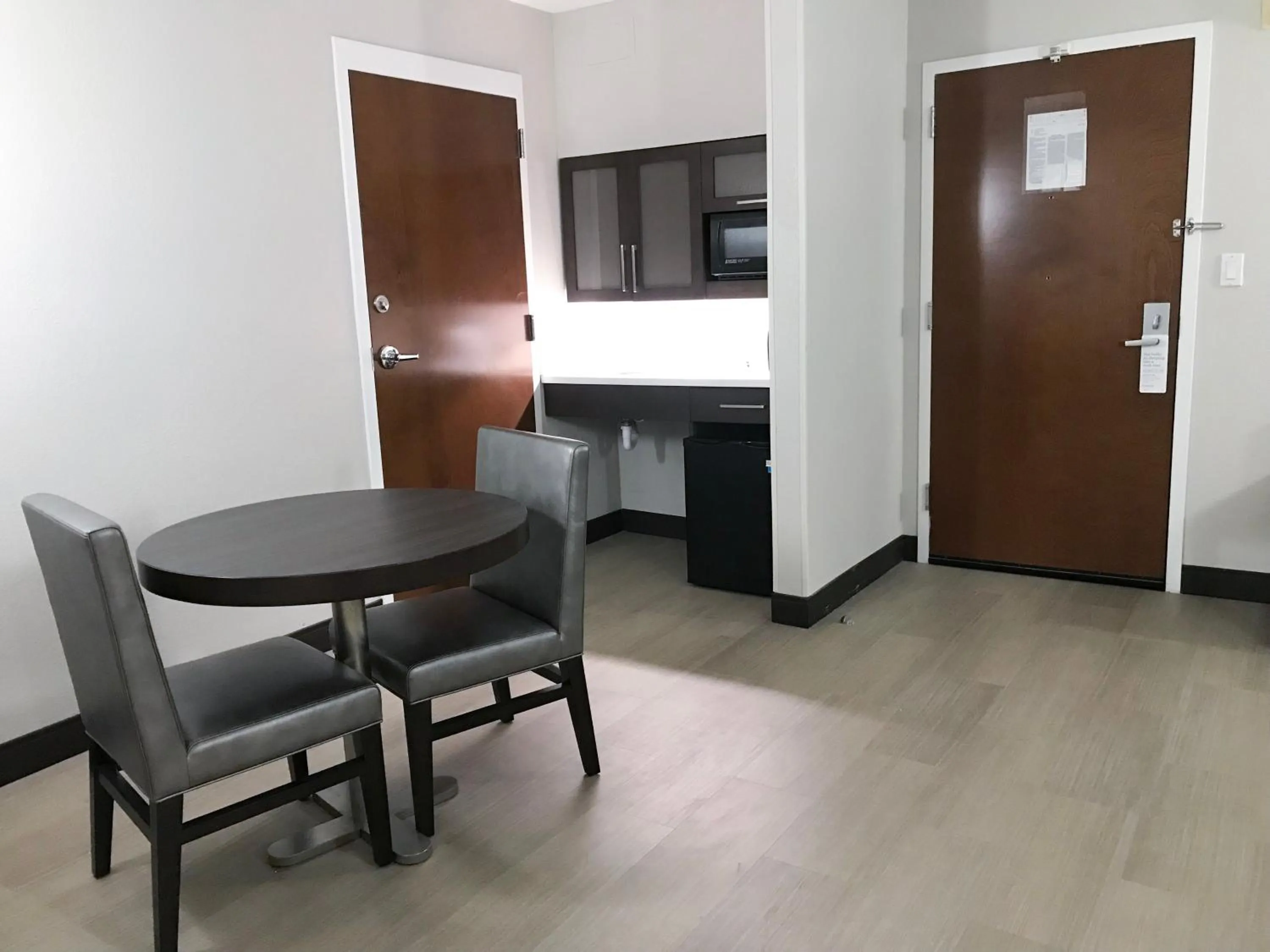 Dining area in Ramada by Wyndham Suites Orlando Airport- Free Airport Shuttle