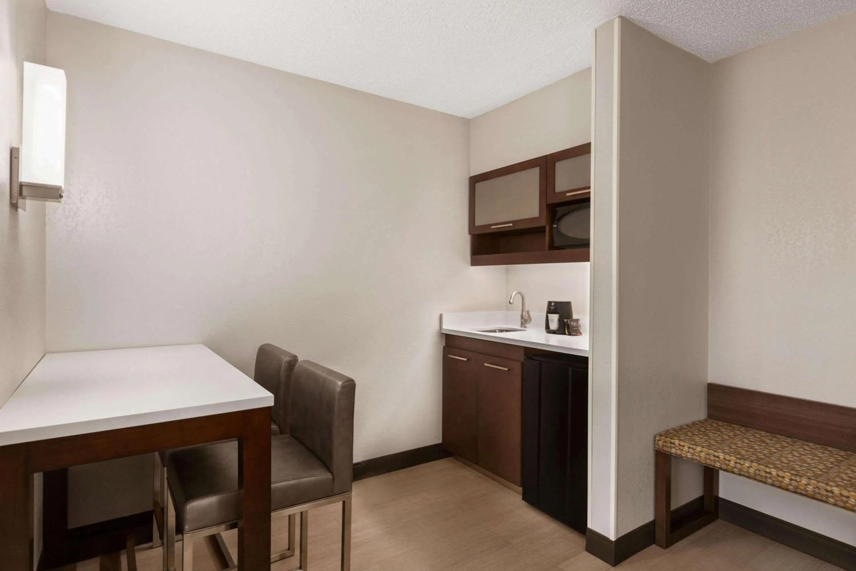 Photo of the whole room in Ramada by Wyndham Suites Orlando Airport- Free Airport Shuttle