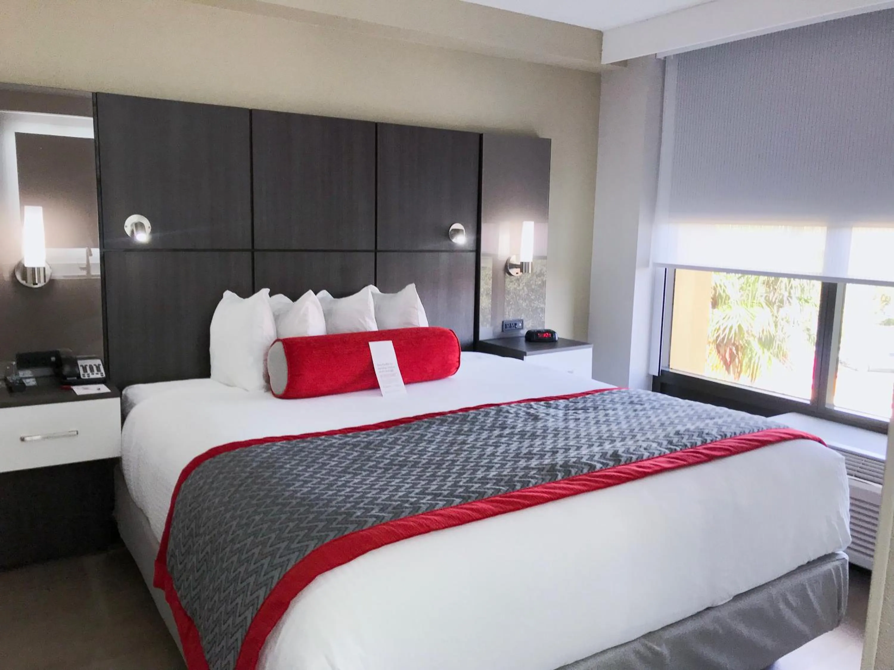 Bedroom, Bed in Ramada by Wyndham Suites Orlando Airport- Free Airport Shuttle