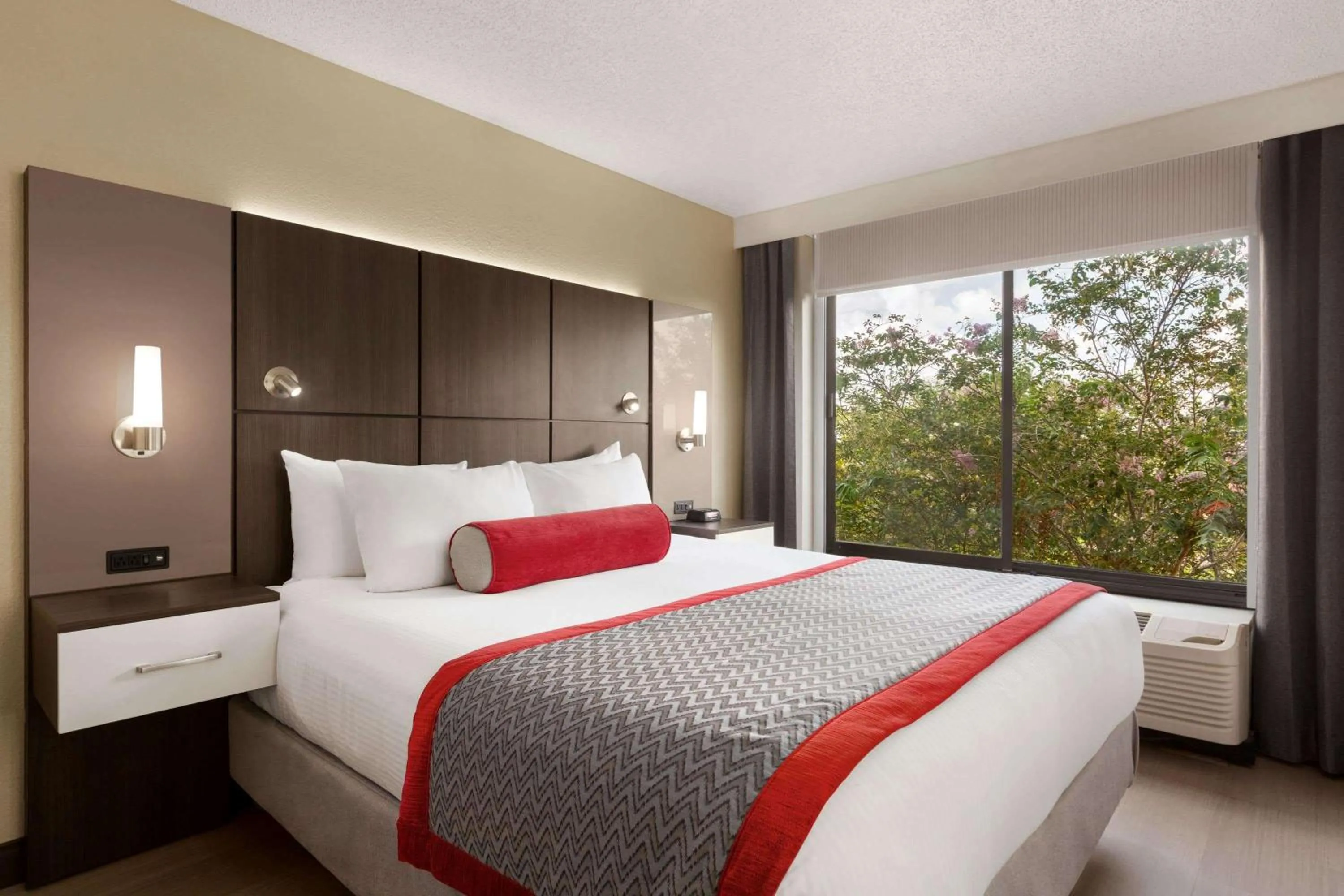 Photo of the whole room, Bed in Ramada by Wyndham Suites Orlando Airport- Free Airport Shuttle