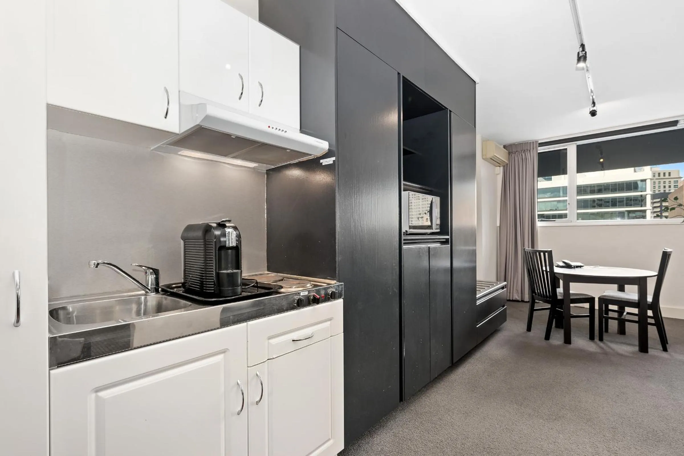 Property logo or sign in Ridge Apartment Hotel