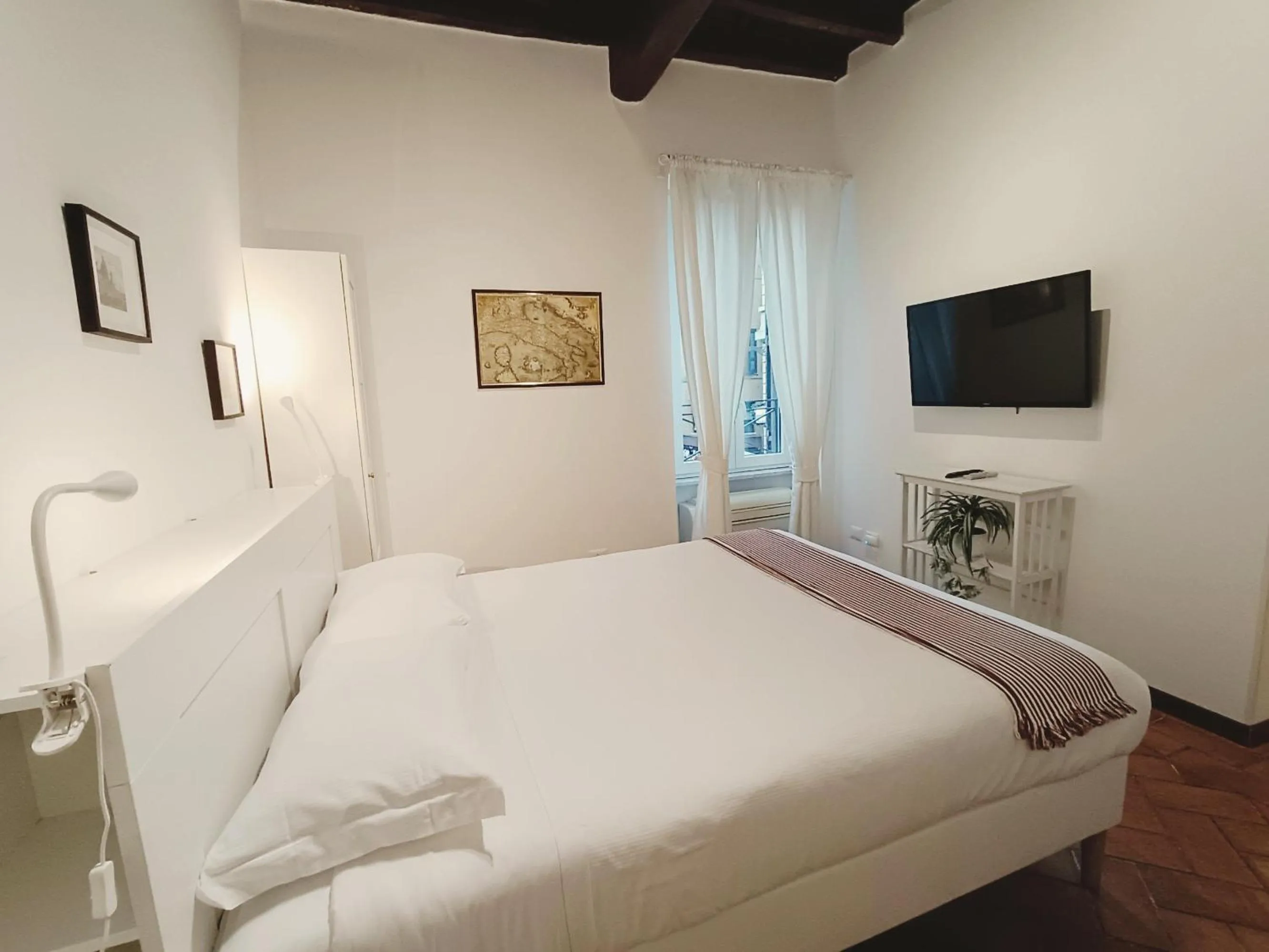 Bed in Piccolo Trevi Suites