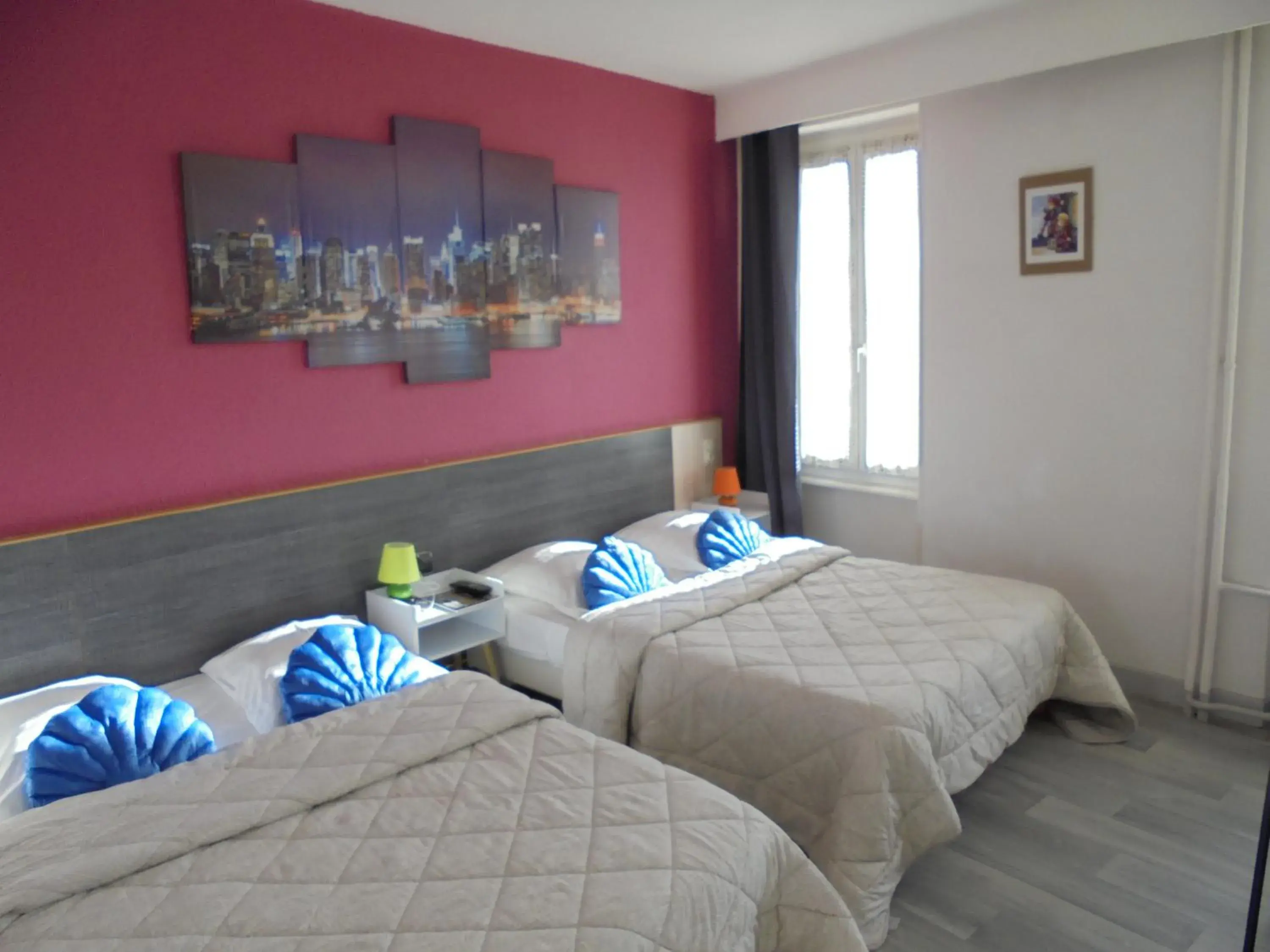 Quadruple Room with two Full Beds (2 Adults + 2 Children) in Hotel De La Gare Quadruple Room with two Full Beds (2 Adults + 2 Children) in Hotel De La Gare