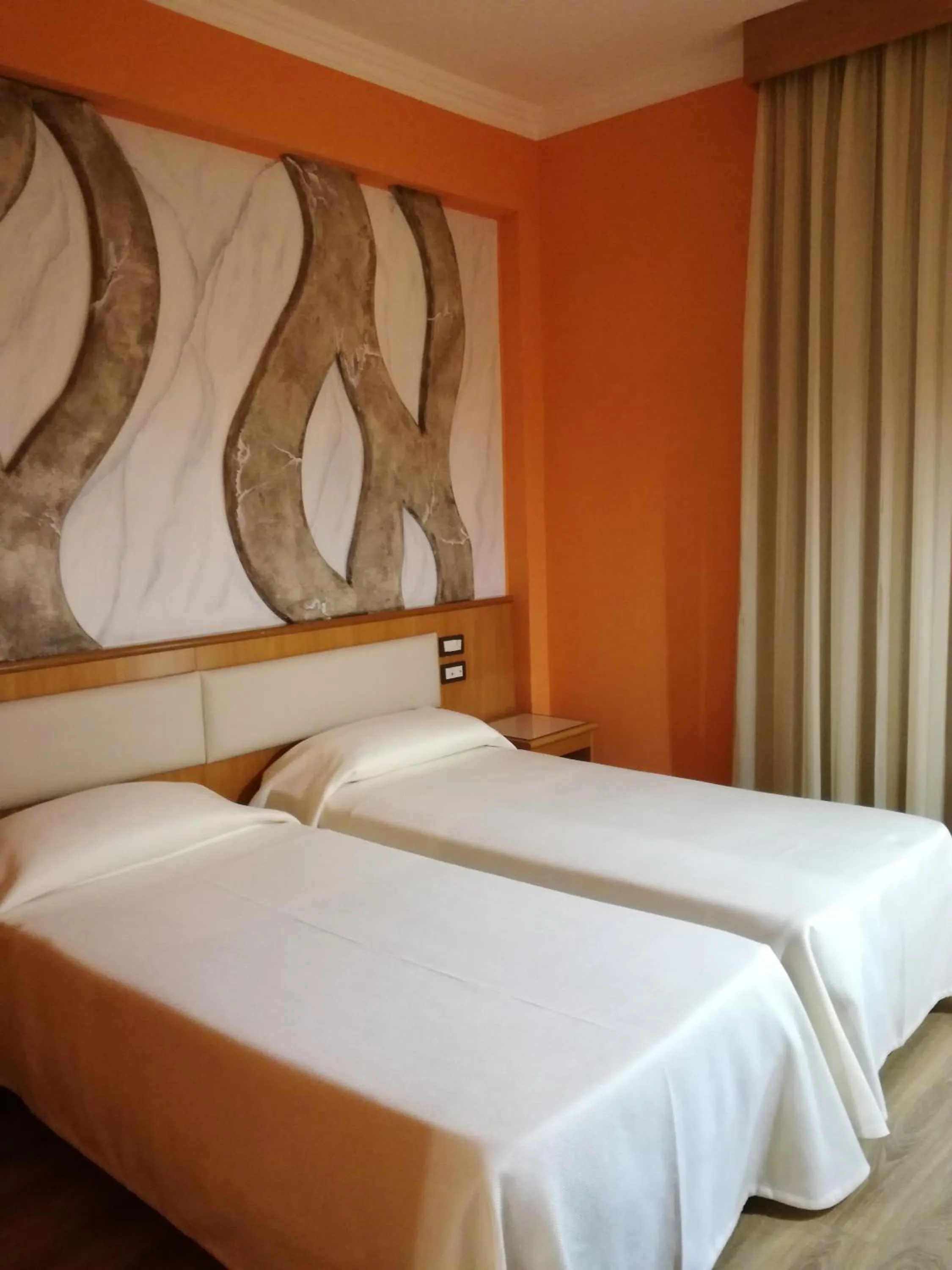 Bed in FILIPPONE HOTEL&RISTORANTE