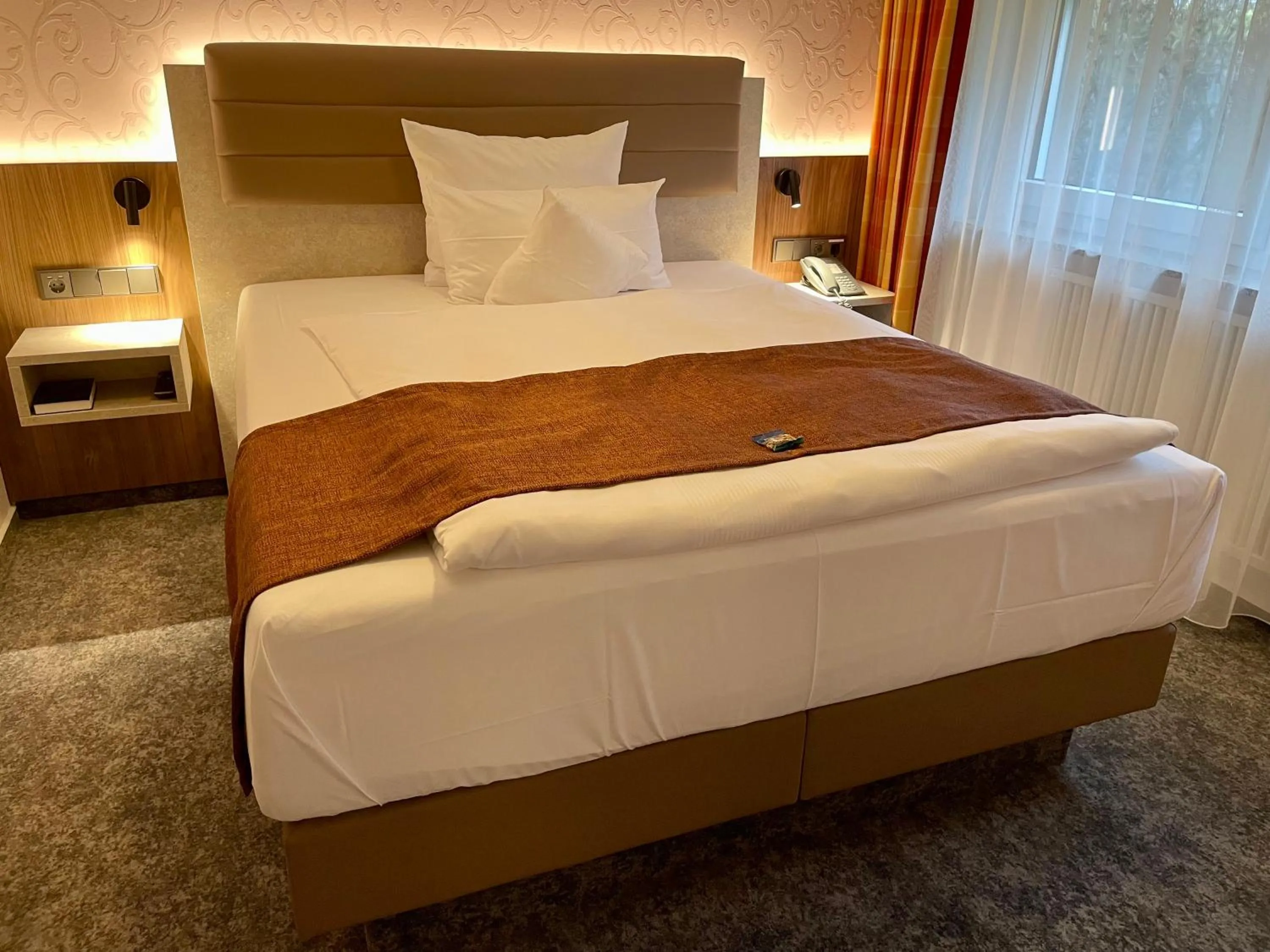 Bed in Hotel Merkur