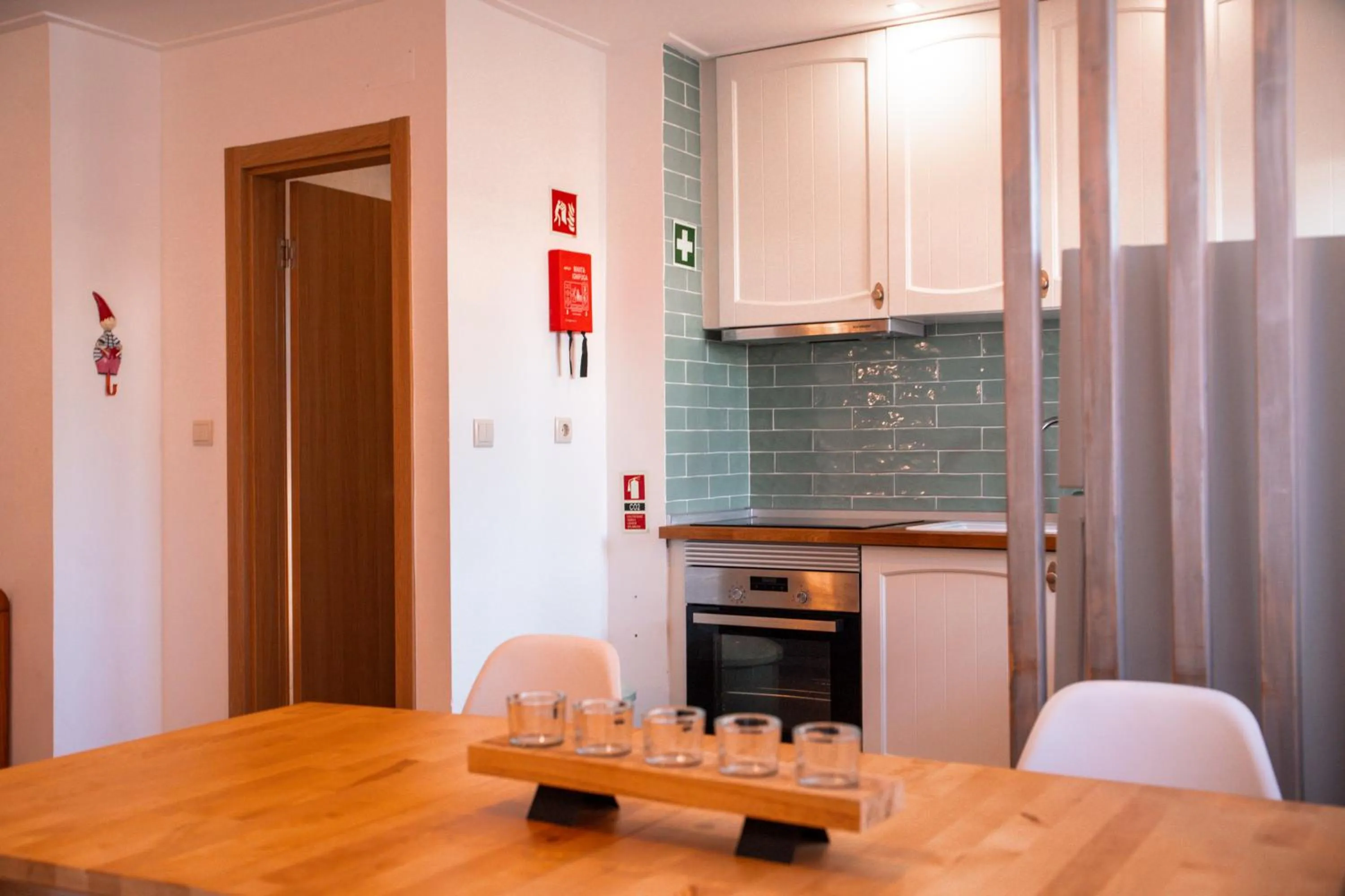 Kitchen or kitchenette in Apartamentos Honorio - Pool and Garden