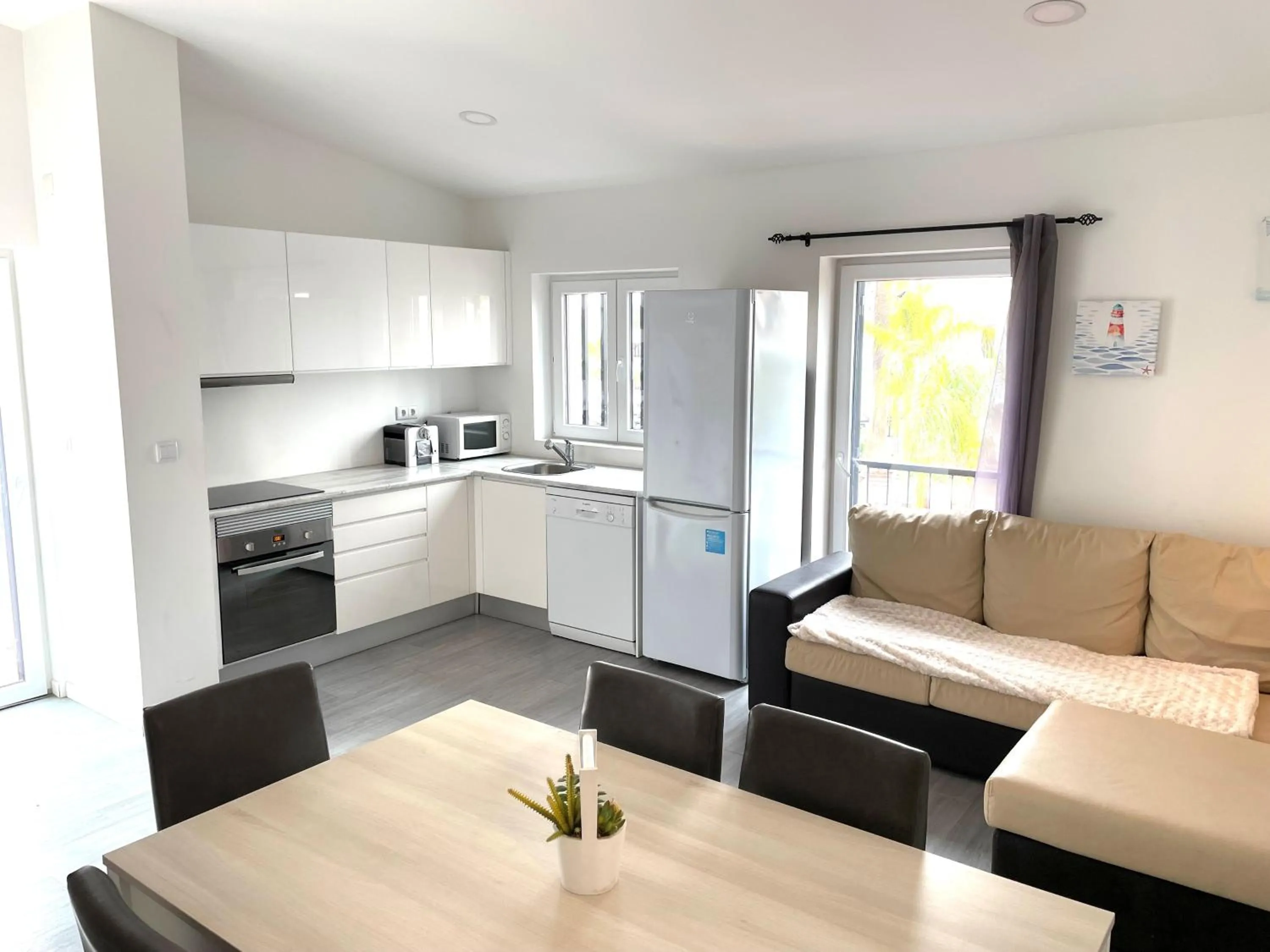 Kitchen or kitchenette in Apartamentos Honorio - Pool and Garden