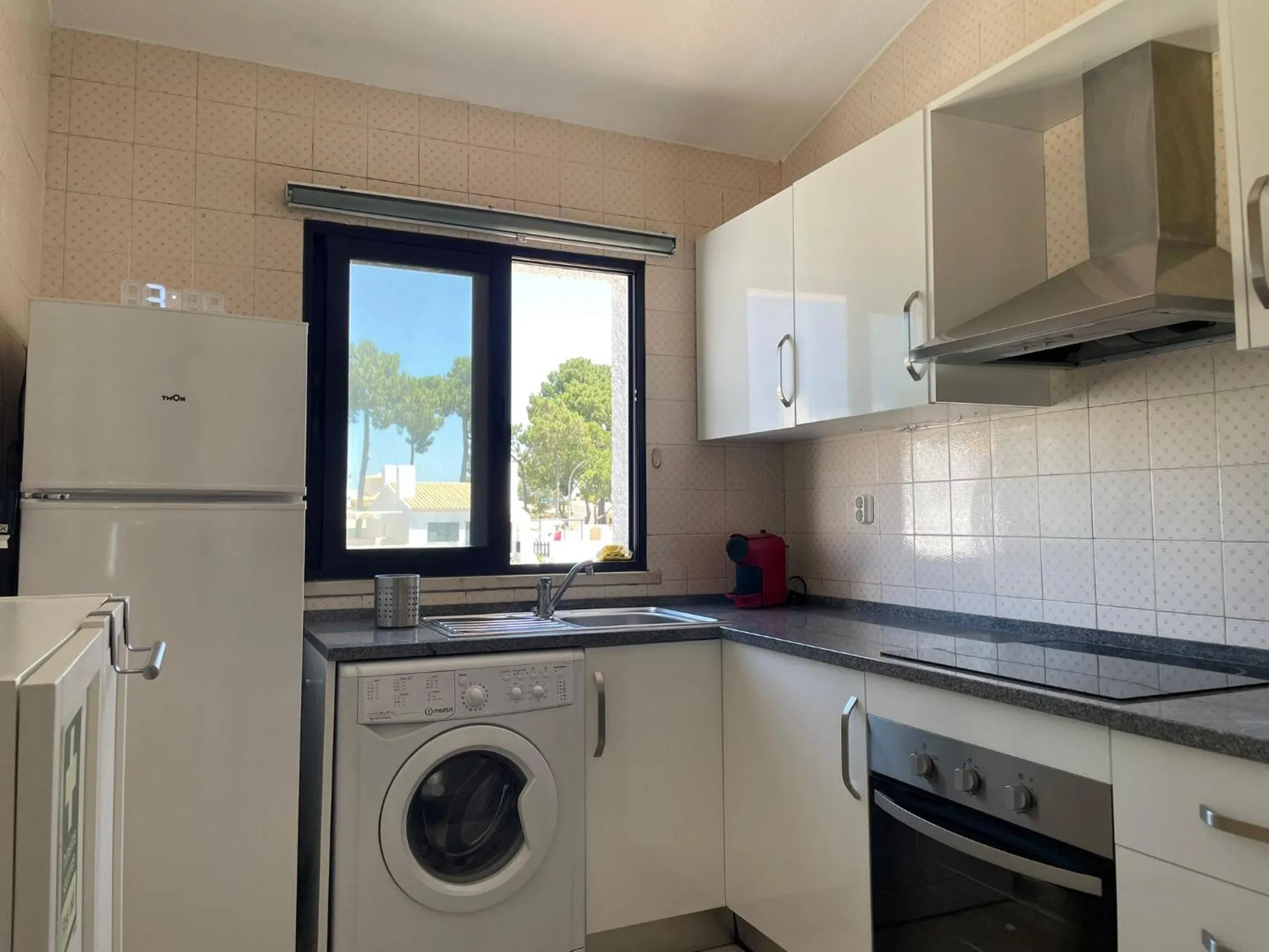 Kitchen or kitchenette in Apartamentos Honorio - Pool and Garden