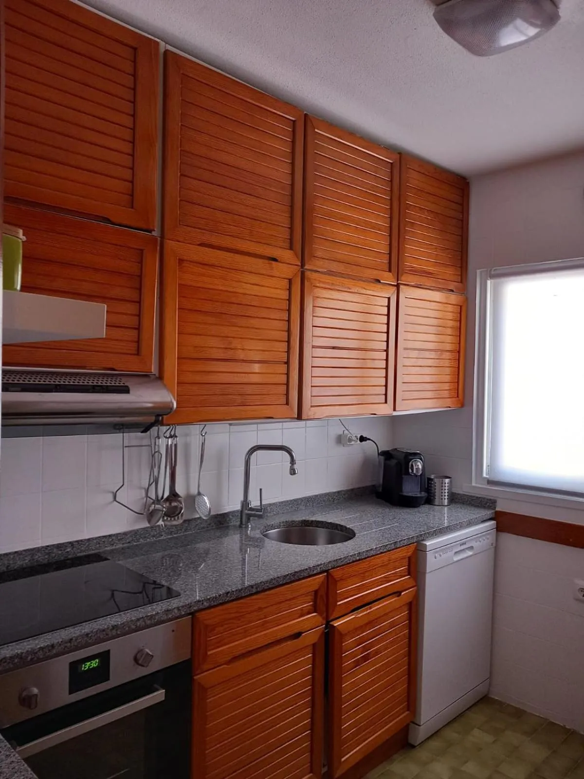 Kitchen or kitchenette in Apartamentos Honorio - Pool and Garden