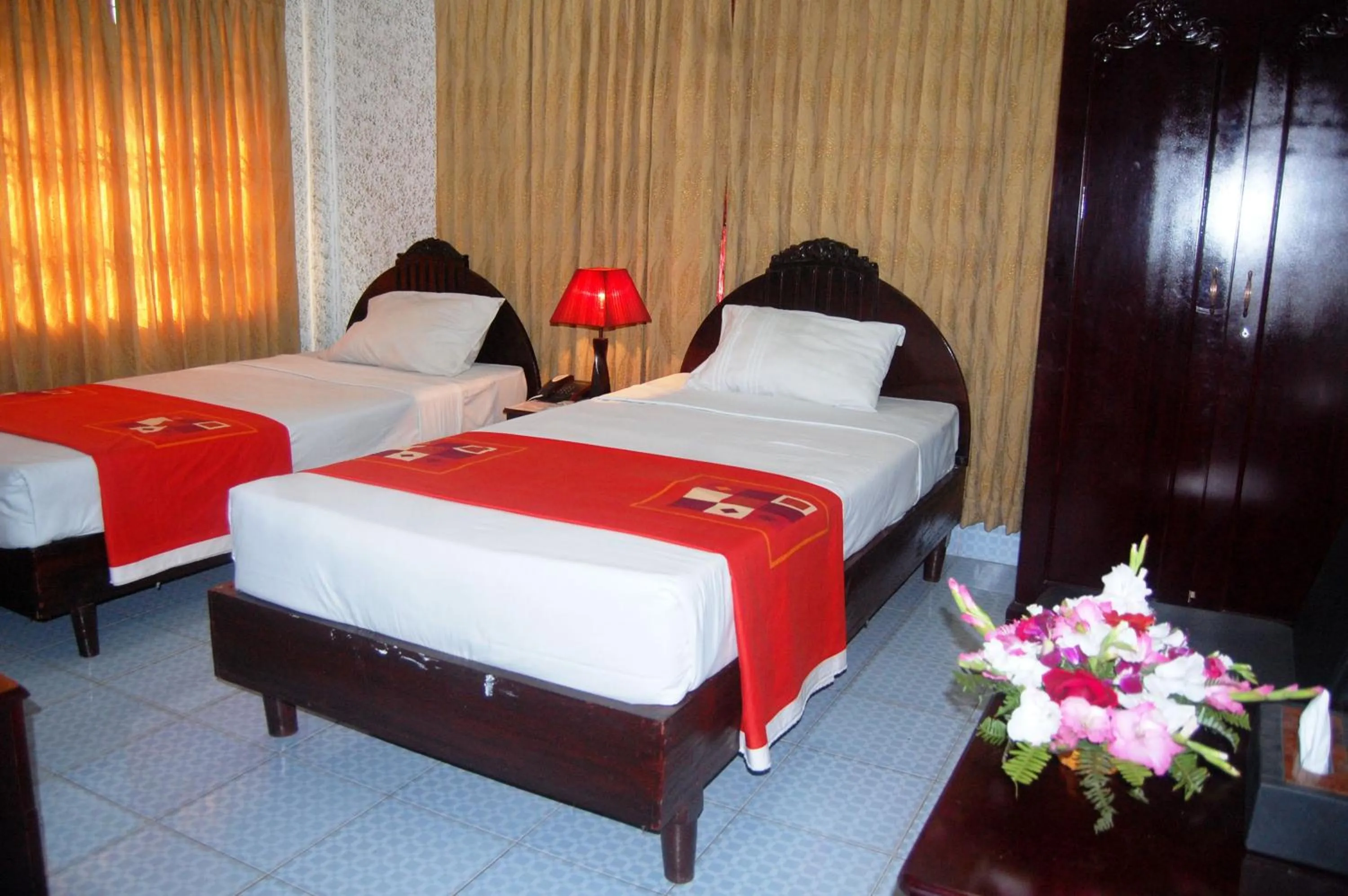 Bed in Hotel Swiss Garden International