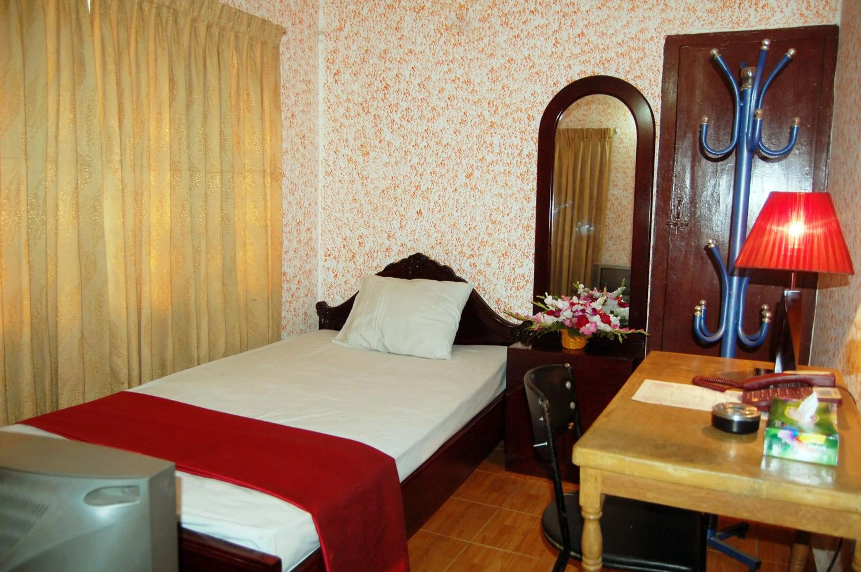 Bed in Hotel Swiss Garden International