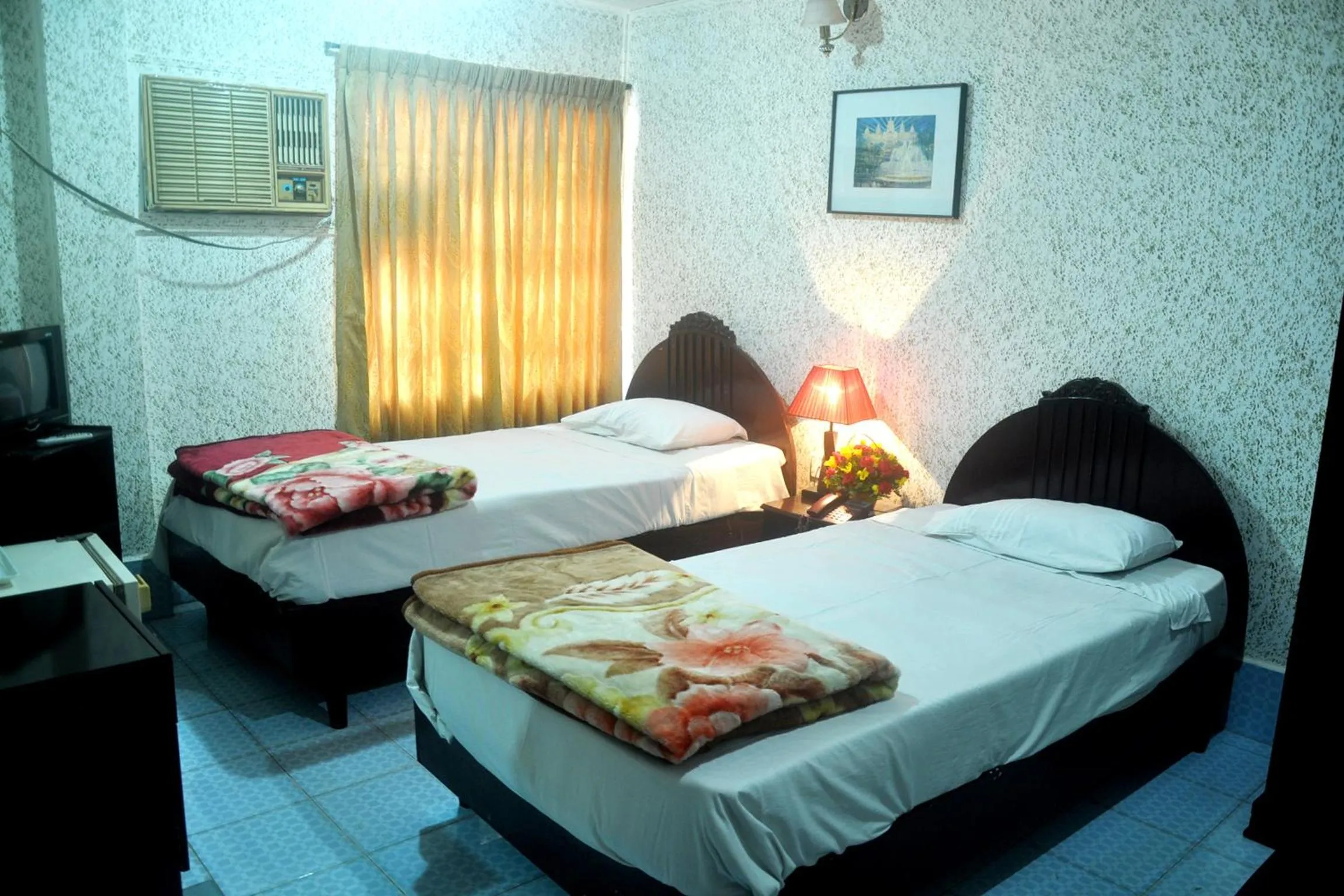 Bed in Hotel Swiss Garden International