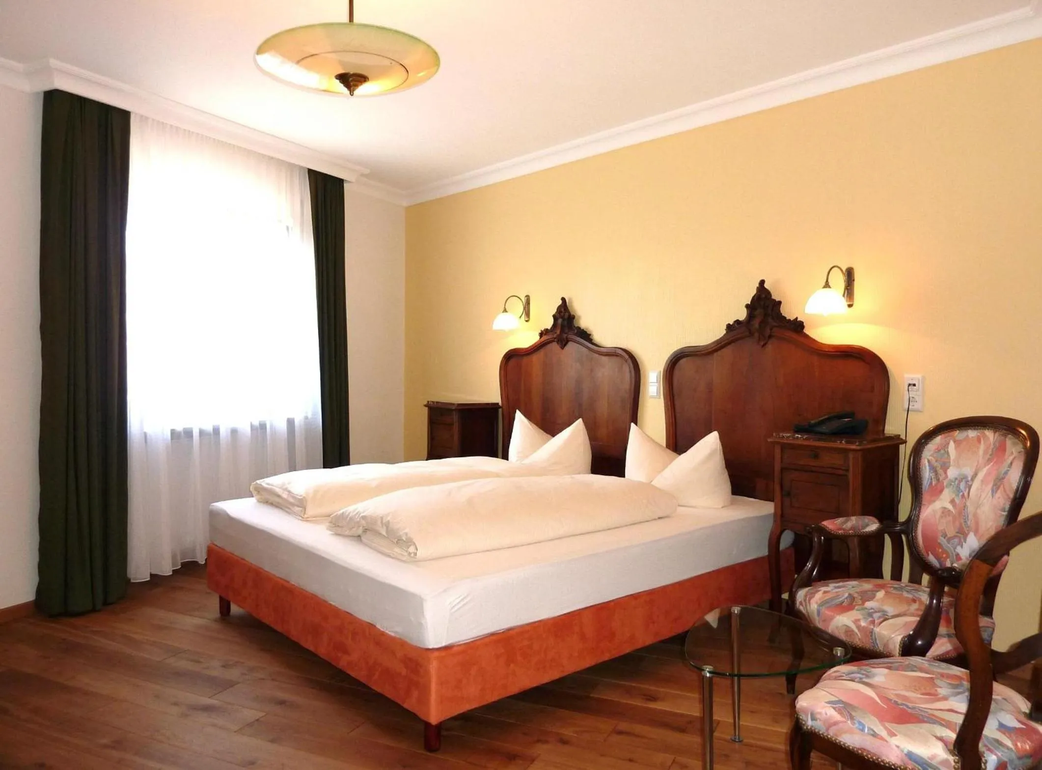 Photo of the whole room, Bed in Historisches Genusshotel Löwen