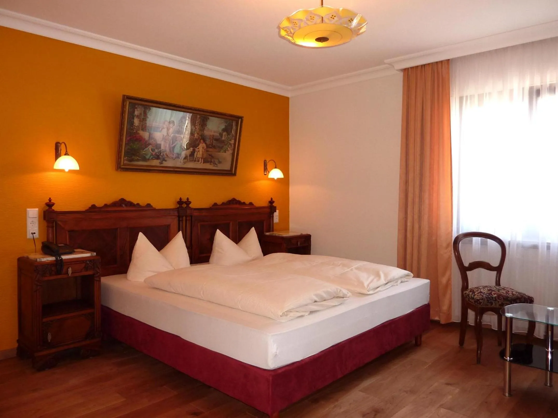 Photo of the whole room, Bed in Historisches Genusshotel Löwen