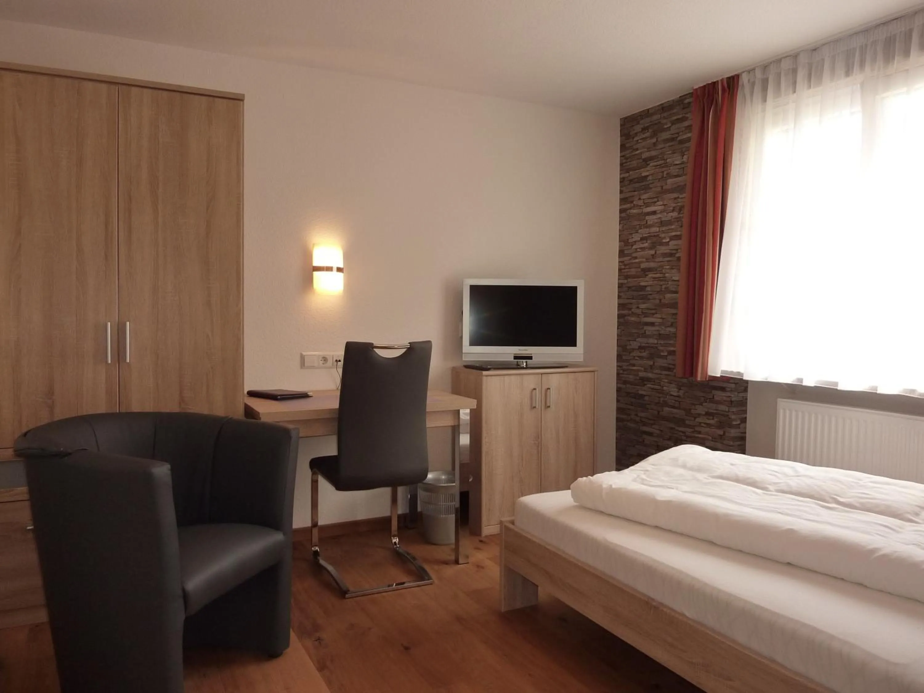 Photo of the whole room, Bed in Historisches Genusshotel Löwen