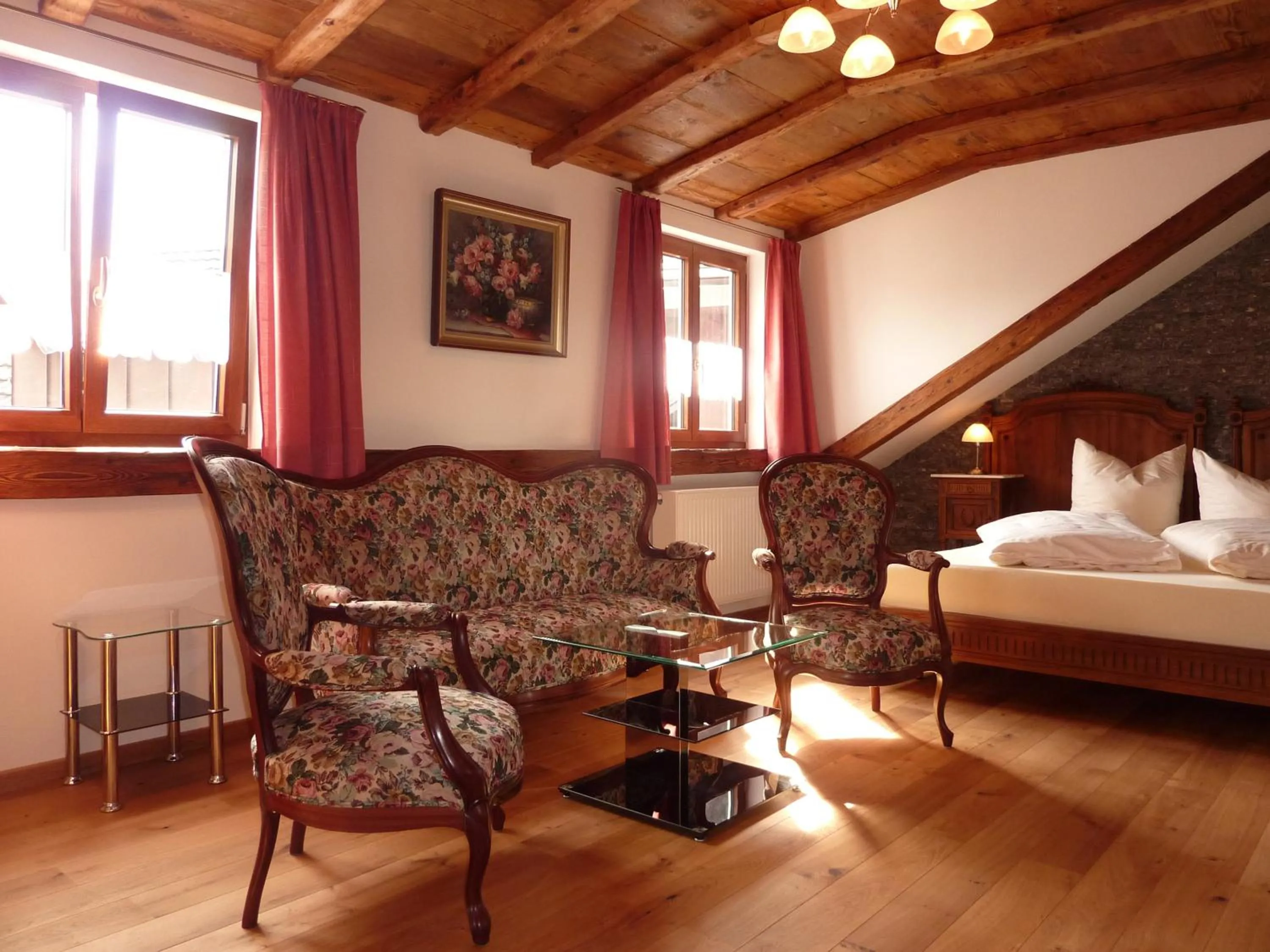 Photo of the whole room, Bed in Historisches Genusshotel Löwen