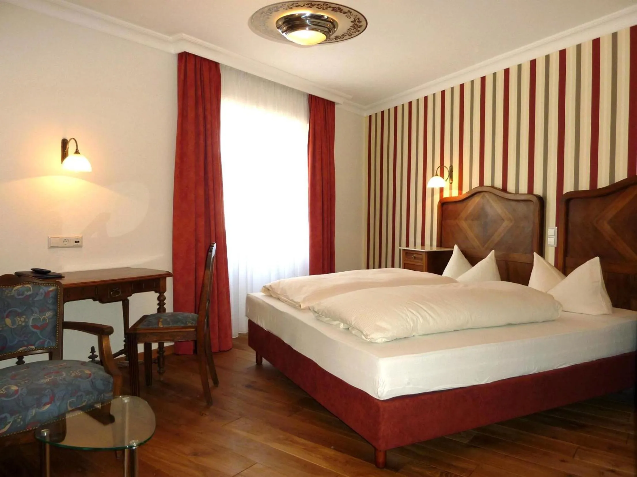 Photo of the whole room, Bed in Historisches Genusshotel Löwen