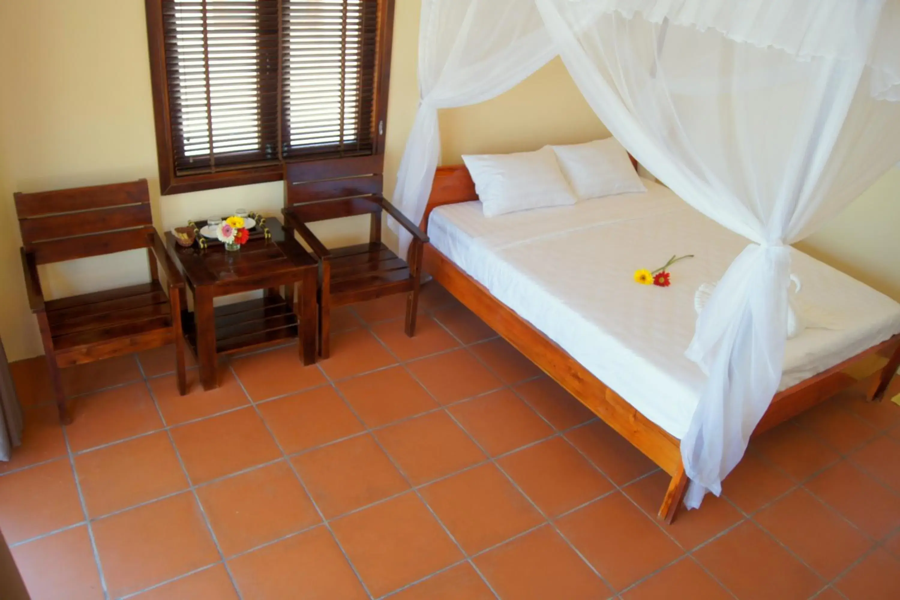 Seating area, Bed in Gold Sand Beach Bungalow Seating area, Bed in Gold Sand Beach Bungalow